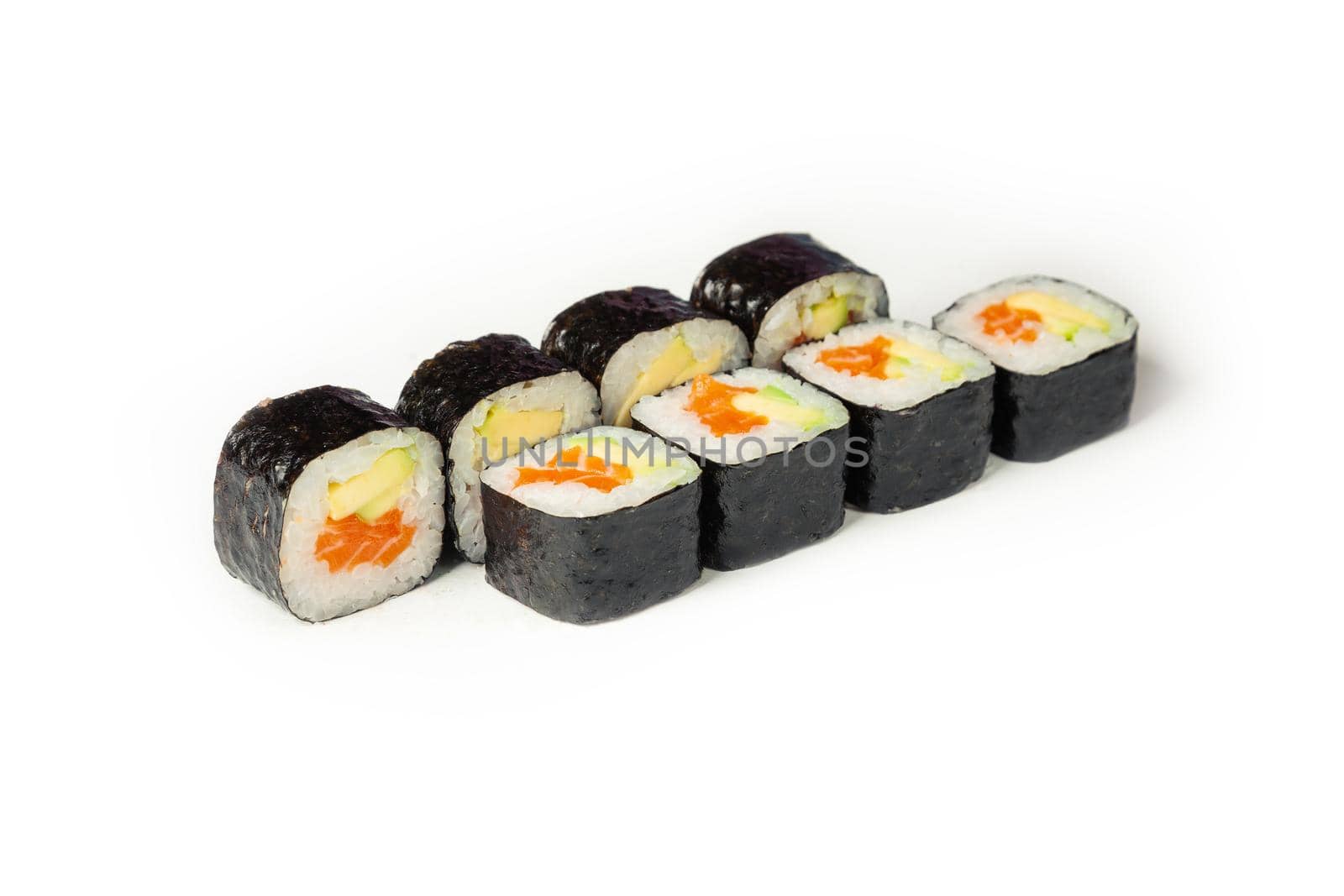 Sushi roll with salmon and avocado on a white plate, classic Japanese sushi. Traditional Japanese food with maki. Delicious pieces of sushi. For the restaurant menu. copyspace.