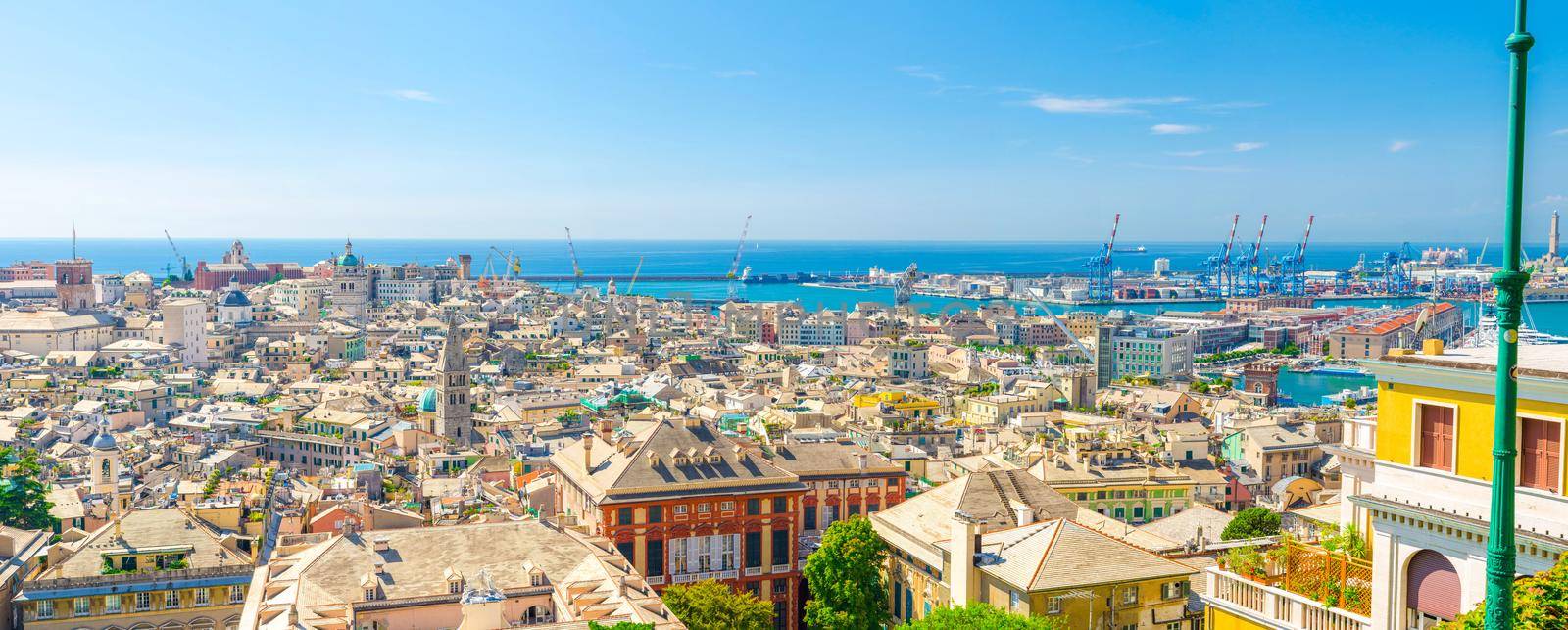 Top aerial scenic panoramic view from above of old historical centre quarter districts, panorama of european city Genoa Genova , port and harbor of Ligurian and Mediterranean Sea, Liguria, Italy