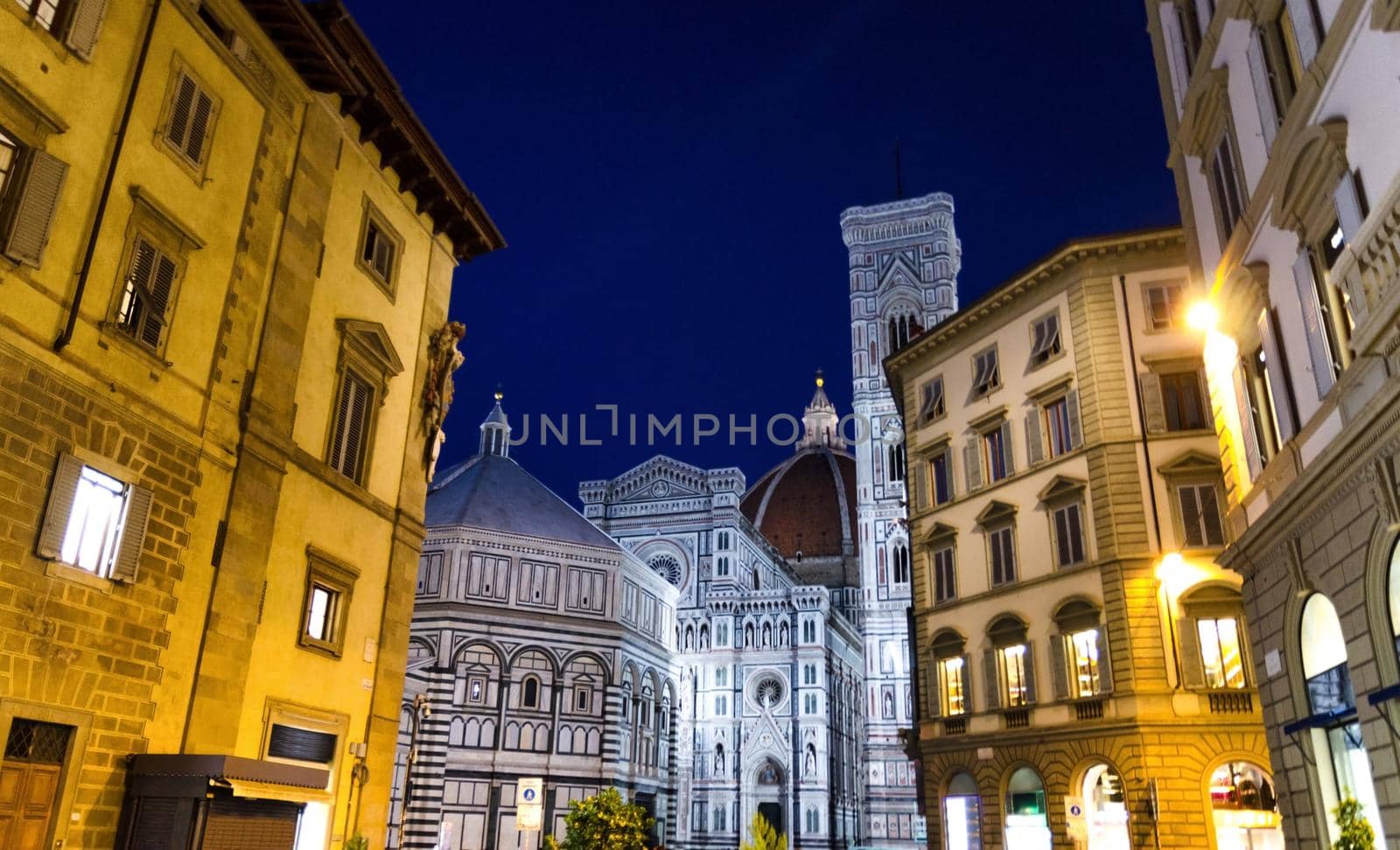 Florence Duomo, Cattedrale di Santa Maria del Fiore, Basilica of Saint Mary of the Flower Cathedral and Battistero di San Giovanni on Piazza del Duomo square in the evening, at night, Tuscany, Italy