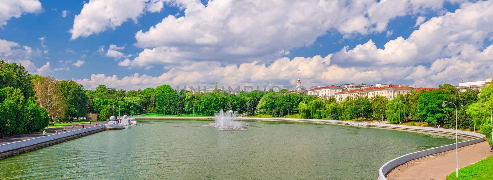 Panorama of Minsk cityscape with Svislach Svislac river embankment Janka Kupala Park and General Headquarters building in historical centre blue sky white clouds, Republic of Belarus