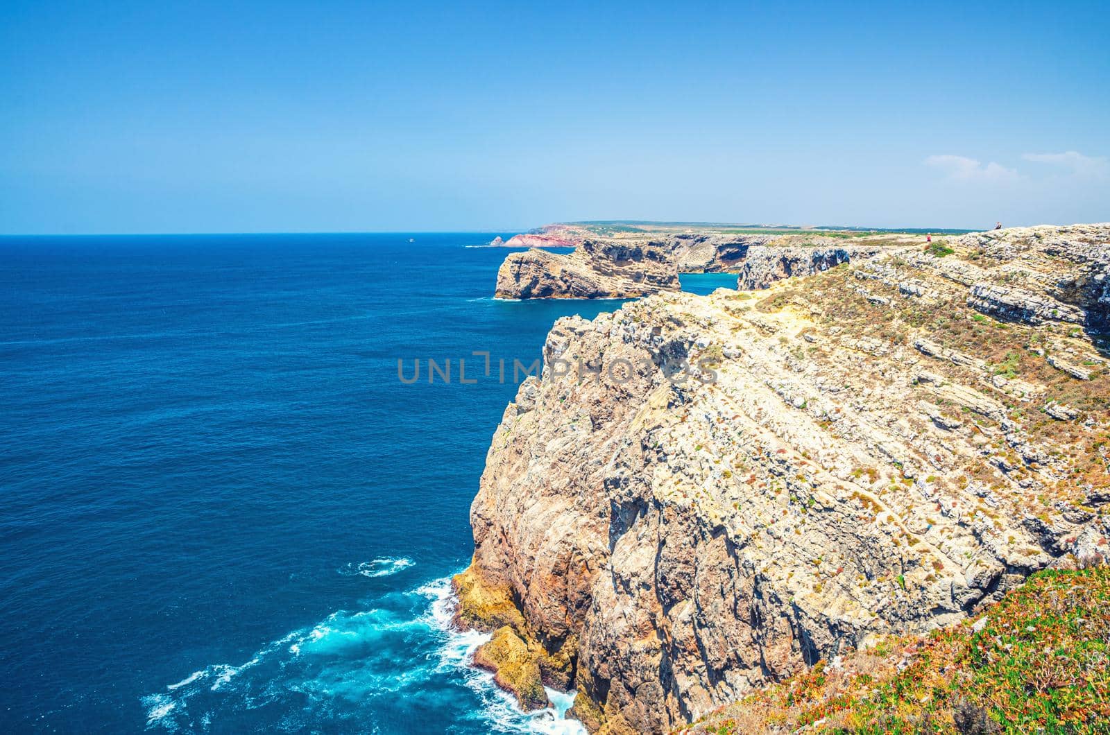 Rocks and cliffs of Atlantic Ocean near Cape Saint Vincent Cabo de Sao Vicente southwesternmost point of mainland Europe, Pedra das Gaivotas island, Portuguese coastline, Algarve district, Portugal