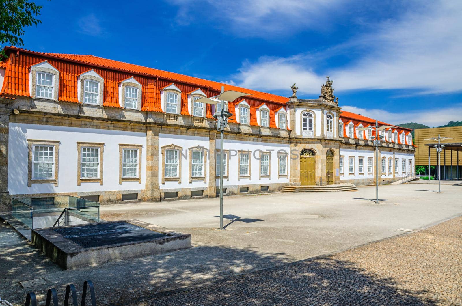Centro Cultural Vila Flor palace palacio building in Guimaraes city historical centre, blue sky white clouds background, Norte or Northern Portugal