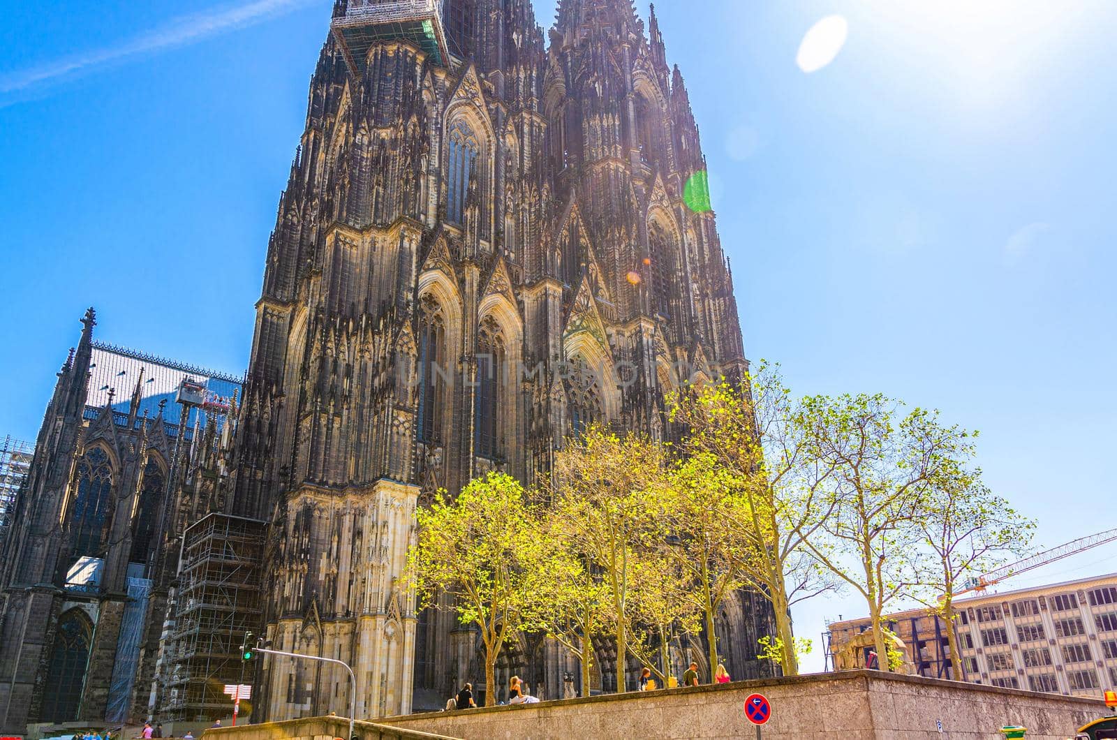 Cologne Cathedral Roman Catholic Church of Saint Peter gothic architectural style building with two huge spires in historical city centre, blue sky in sunny day, North Rhine-Westphalia, Germany