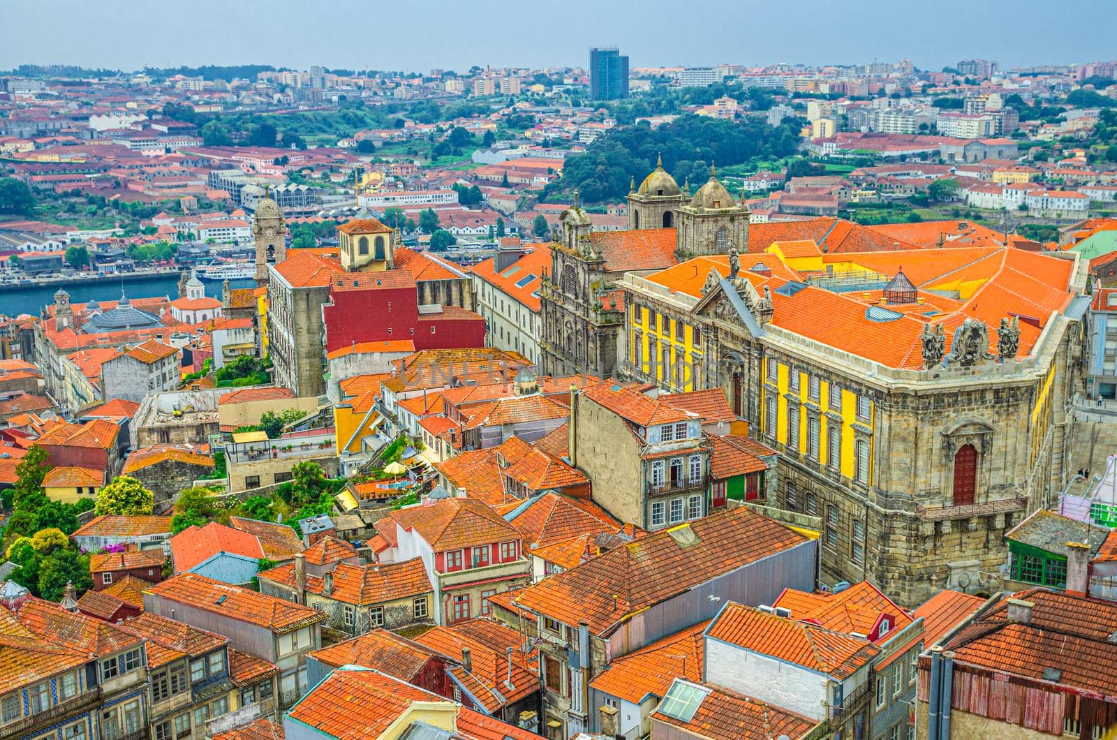 Aerial view of Porto Oporto city historical centre with red tiled roof typical buildings, Douro River, Igreja de Sao Bento da Vitoria church and Vila Nova de Gaia city background, Northern Portugal