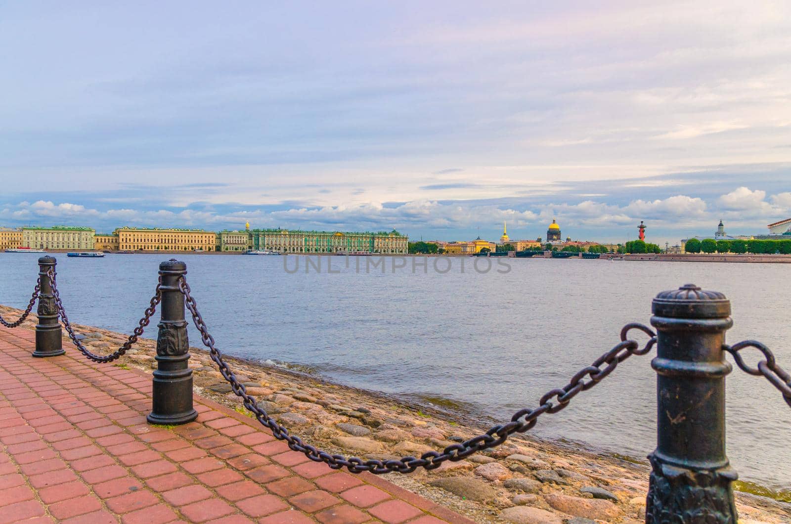 Promenade of Zayachy Hare Island with Fencing chain posts, Neva river, Cityscape of Saint Petersburg Leningrad city with Winter Palace, State Hermitage Museum, Saint Isaac's Cathedral, Russia