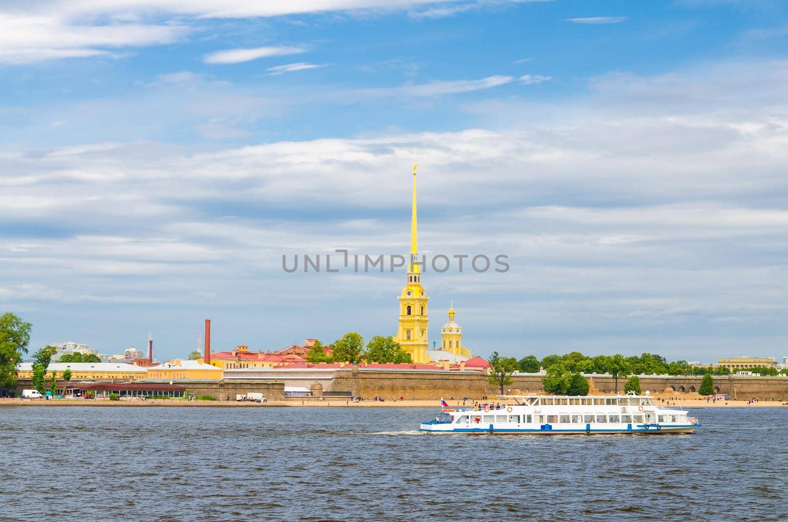 The Peter and Paul Fortress citadel, Saints Peter and Paul Cathedral Orthodox church with gold spire, fortress walls on Zayachy Hare Island, Neva river, Saint Petersburg Leningrad city, Russia