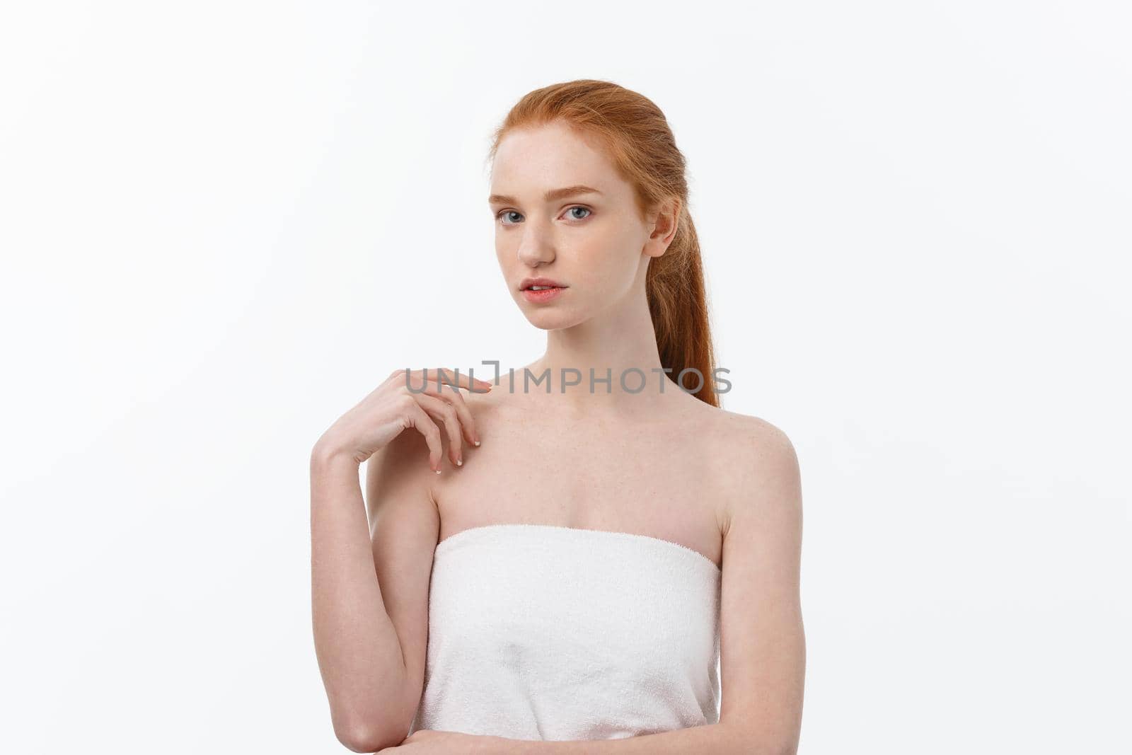 Beauty Woman. Beautiful Young Female touching Her Skin. Portrait isolated on White Background. Healthcare. Perfect Skin. Beauty Face.