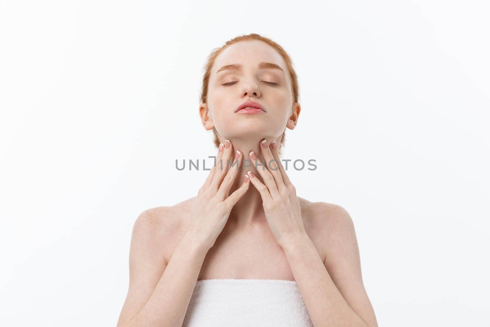 Beauty Woman. Beautiful Young Female touching Her Skin. Portrait isolated on White Background. Healthcare. Perfect Skin. Beauty Face.