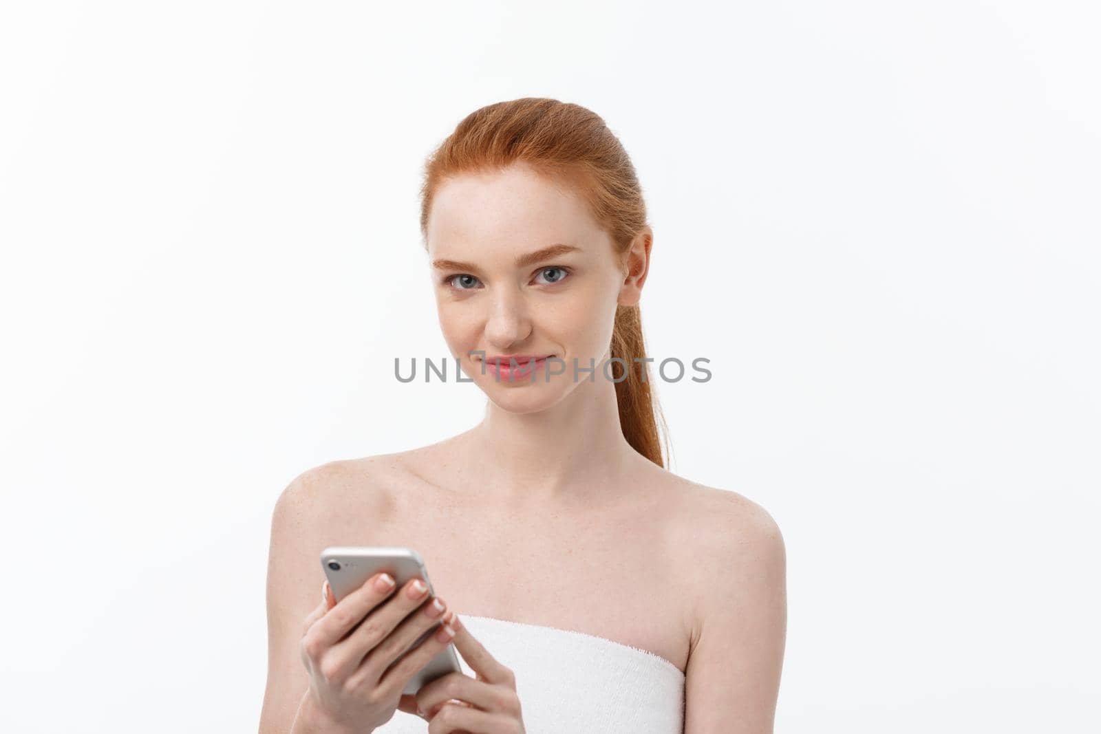 portrait of beautiful girl with phone conversation. Isolated on light white background.