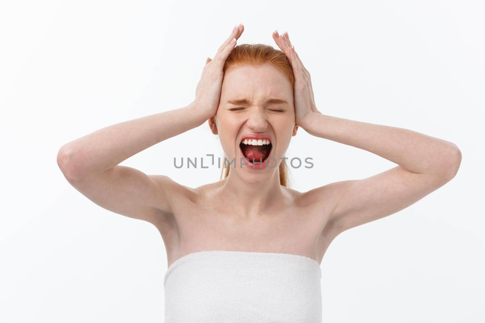 Portrait of young woman with shocked facial expression