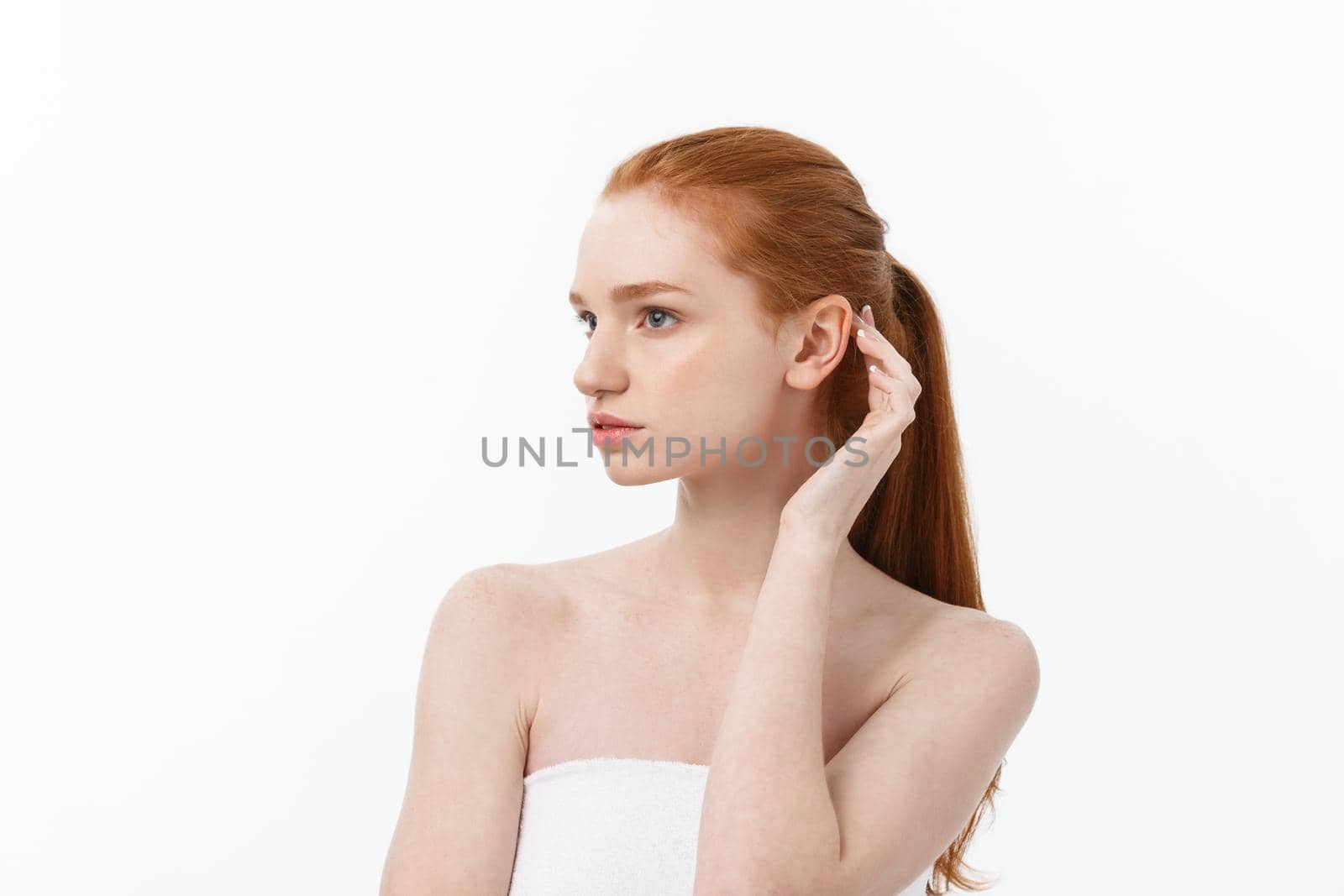 Beauty Woman. Beautiful Young Female touching Her Skin. Portrait isolated on White Background. Healthcare. Perfect Skin. Beauty Face.