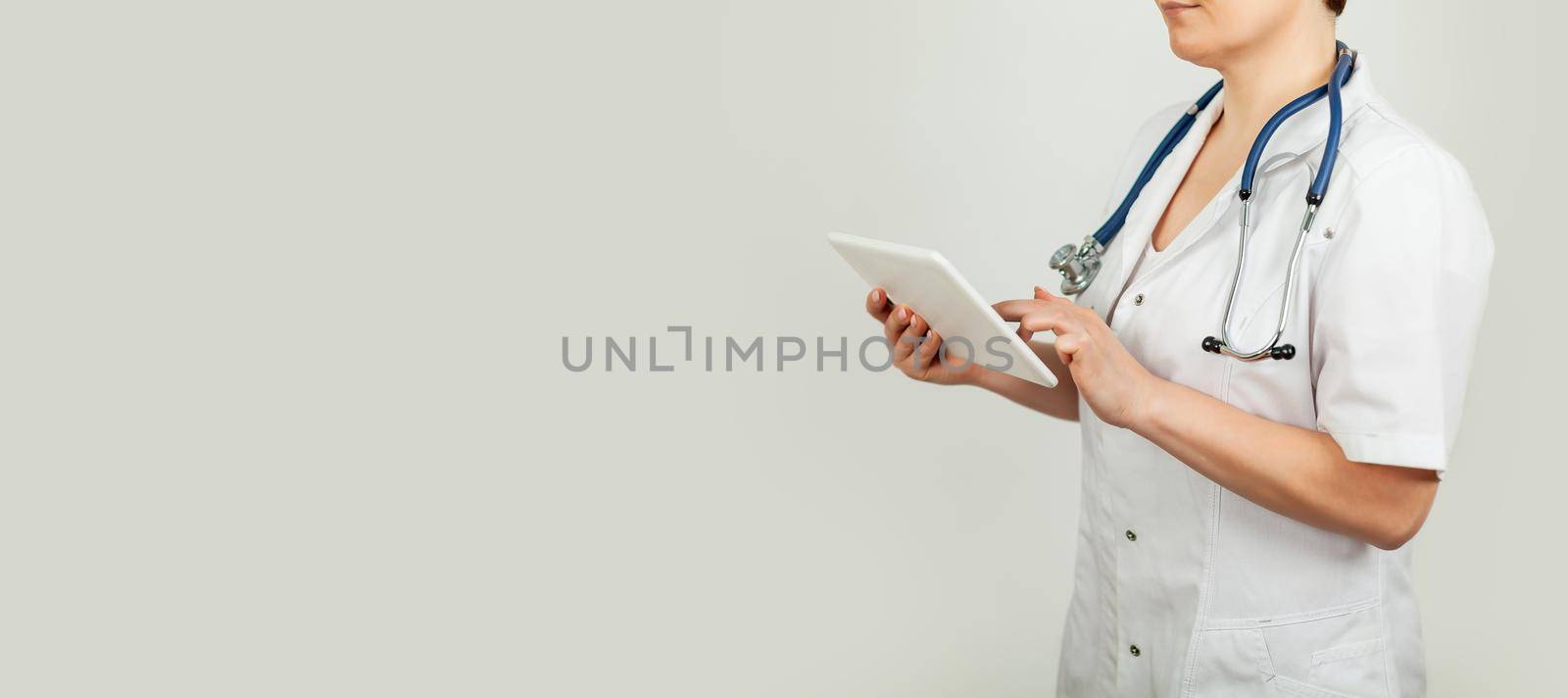 Doctor using a tablet and check with the analysis of the DNA chromosome of a genetic person on a virtual interface. Medicine. Medical science and biotechnology
