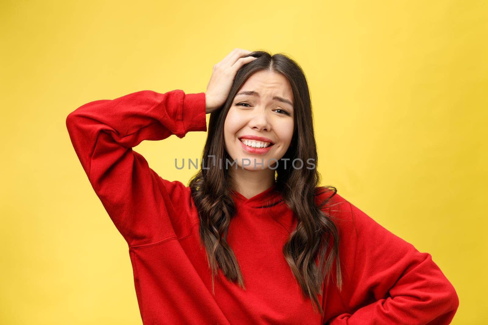 Portrait Happy Asian girl is surprised she is excited.Yellow background studio.