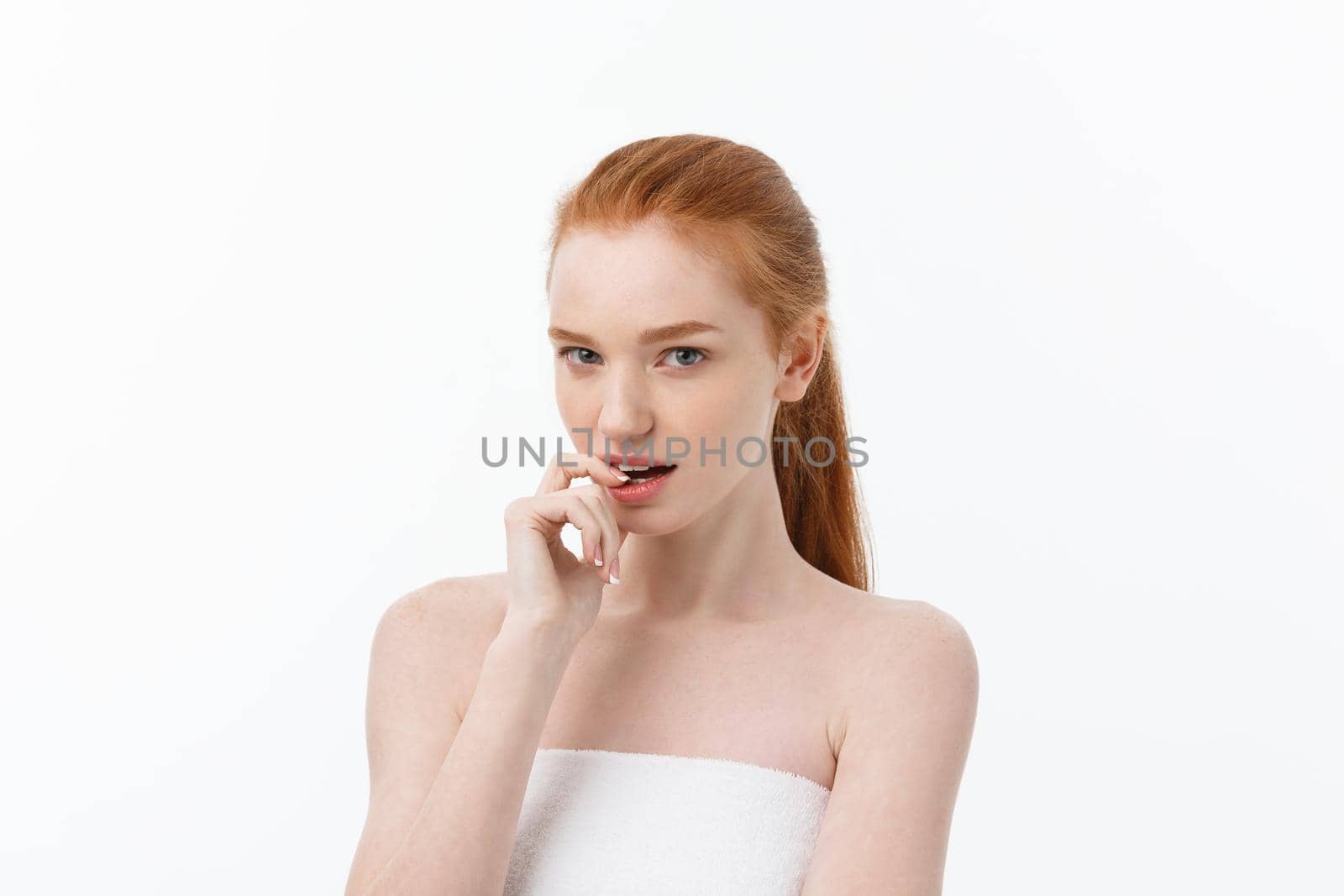 Close-up portrait of beautiful, fresh, healthy and sensual girl over white background.