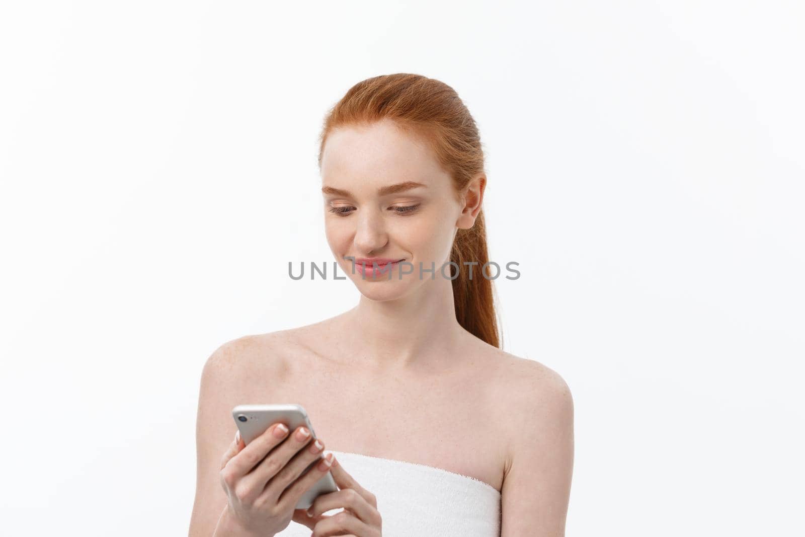 portrait of beautiful girl with phone conversation. Isolated on light white background.
