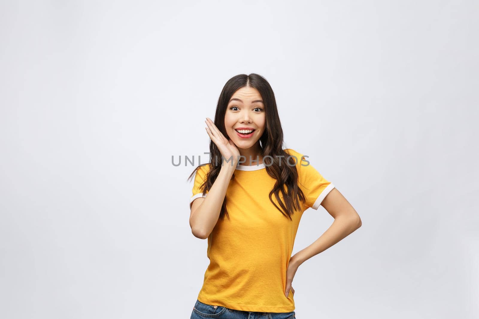 Happy young asian woman with blank copy space area for text or slogan,Closeup portrait of beautiful Asian woman,girl,Positive human emotion facial expression,isolated on white background.