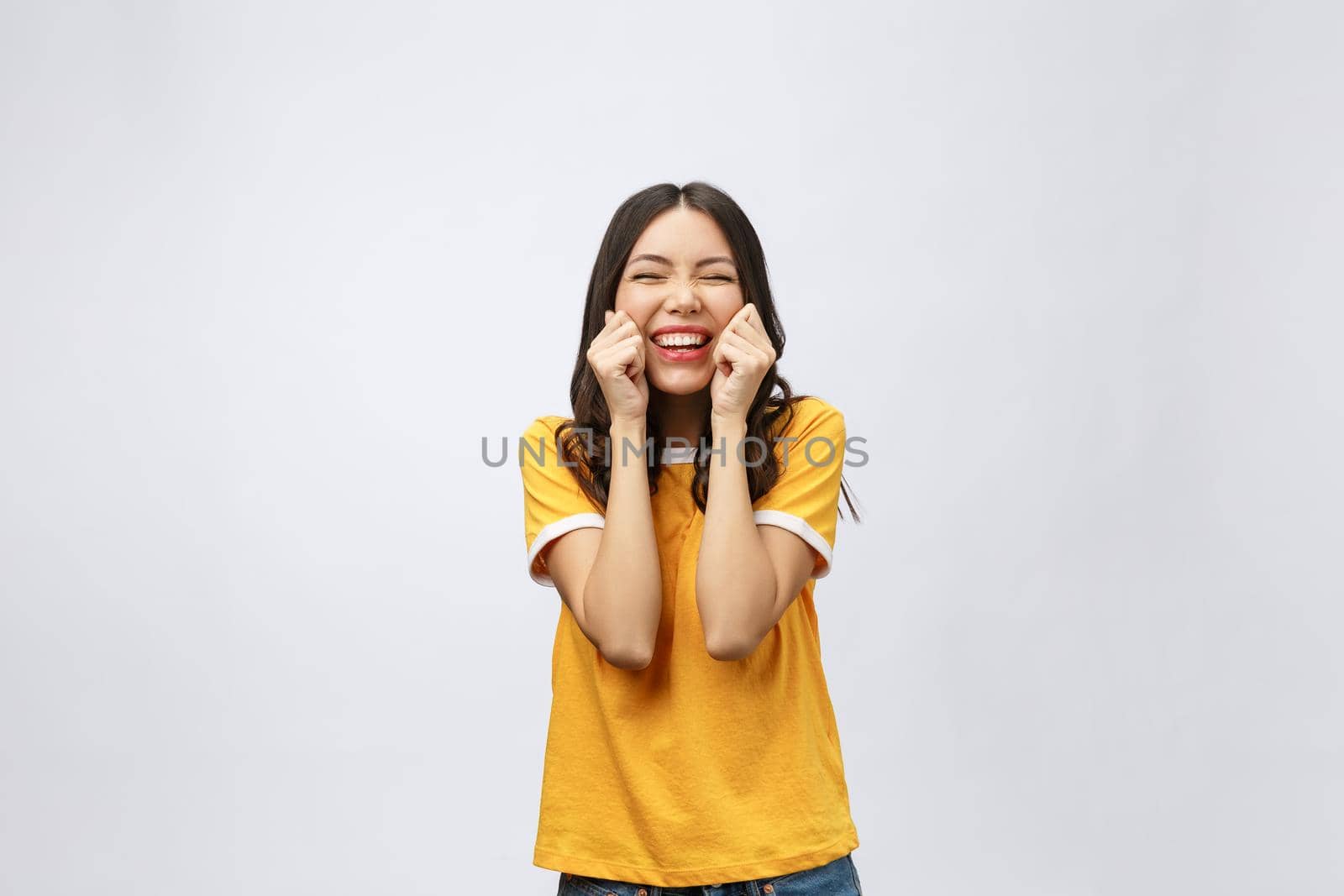 Happy young asian woman with blank copy space area for text or slogan,Closeup portrait of beautiful Asian woman,girl,Positive human emotion facial expression,isolated on white background.