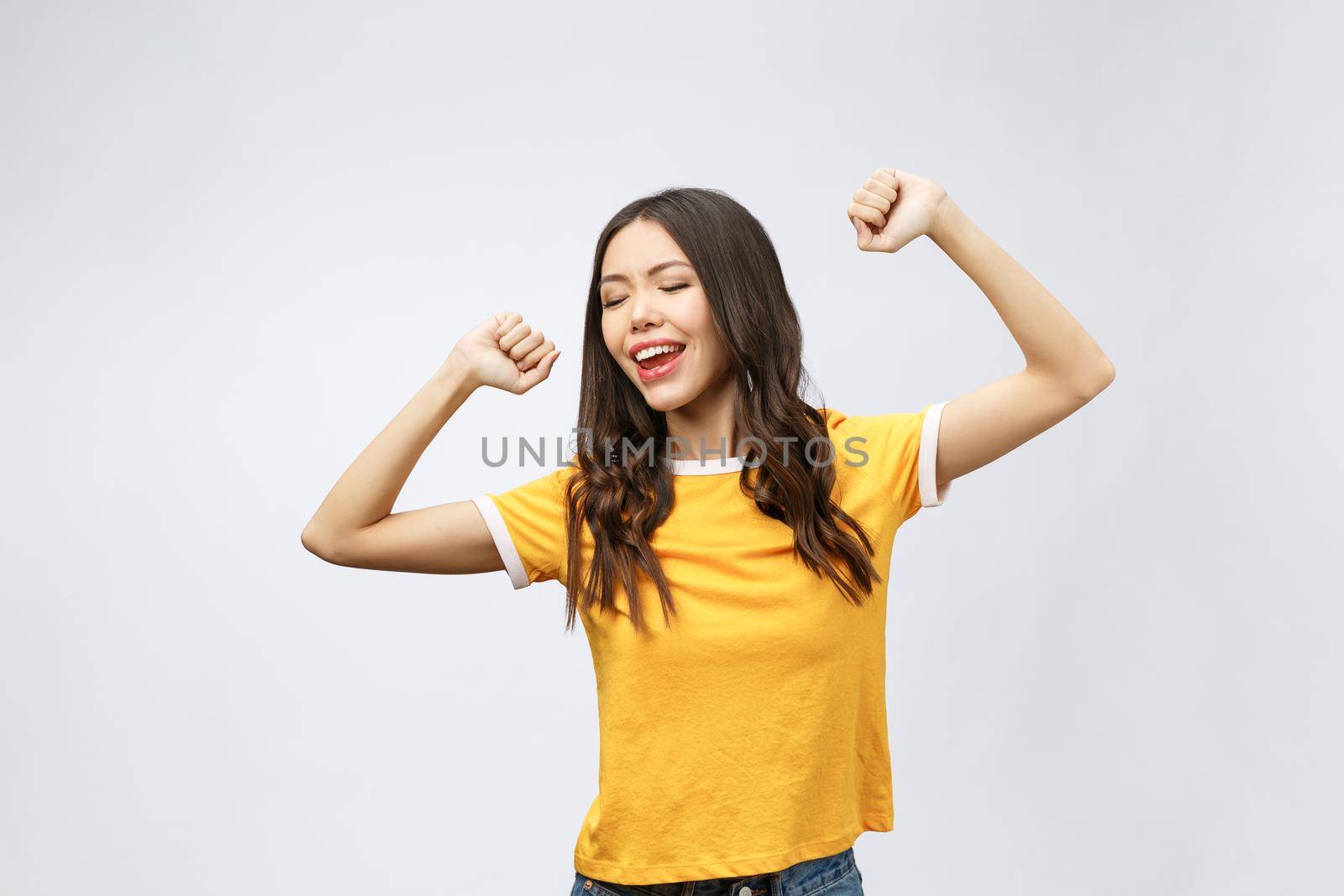 Asian women happiness hand up with winning or success something