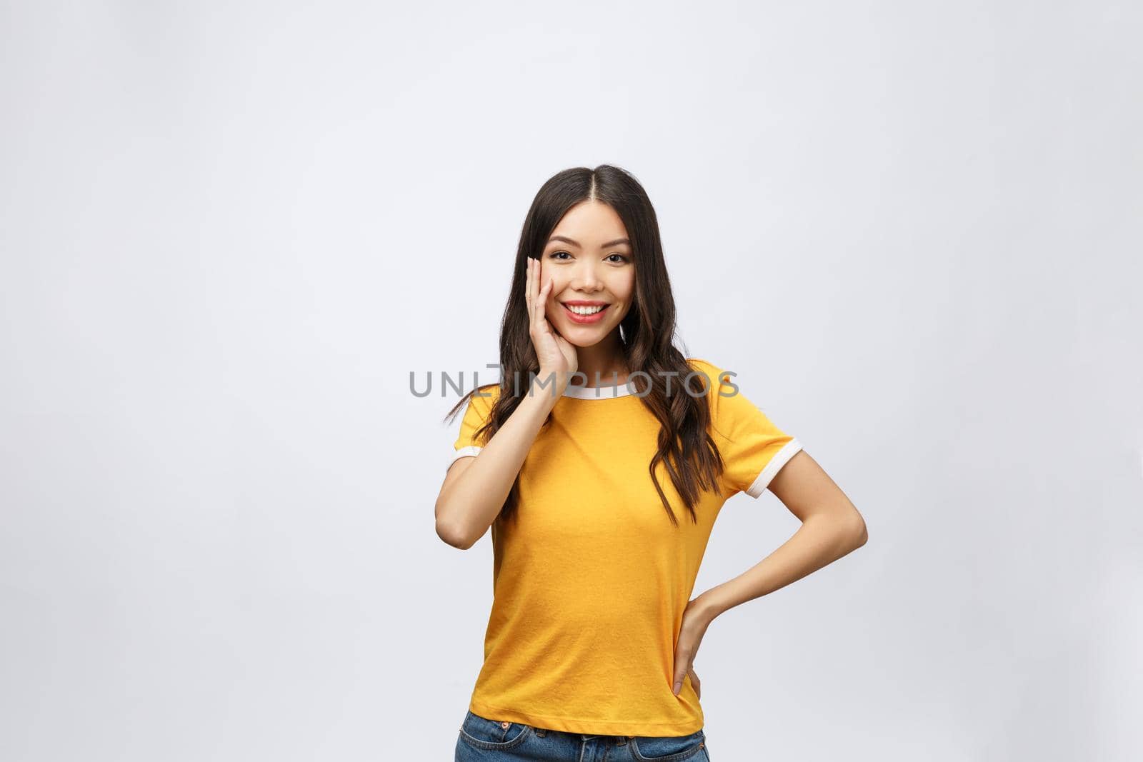 Happy young asian woman with blank copy space area for text or slogan,Closeup portrait of beautiful Asian woman,girl,Positive human emotion facial expression,isolated on white background.