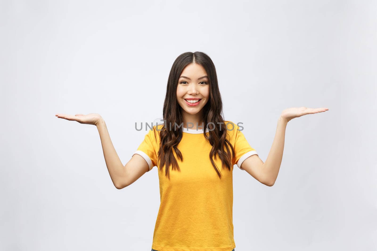 Smiling woman showing copy space for product,message isolated on white background