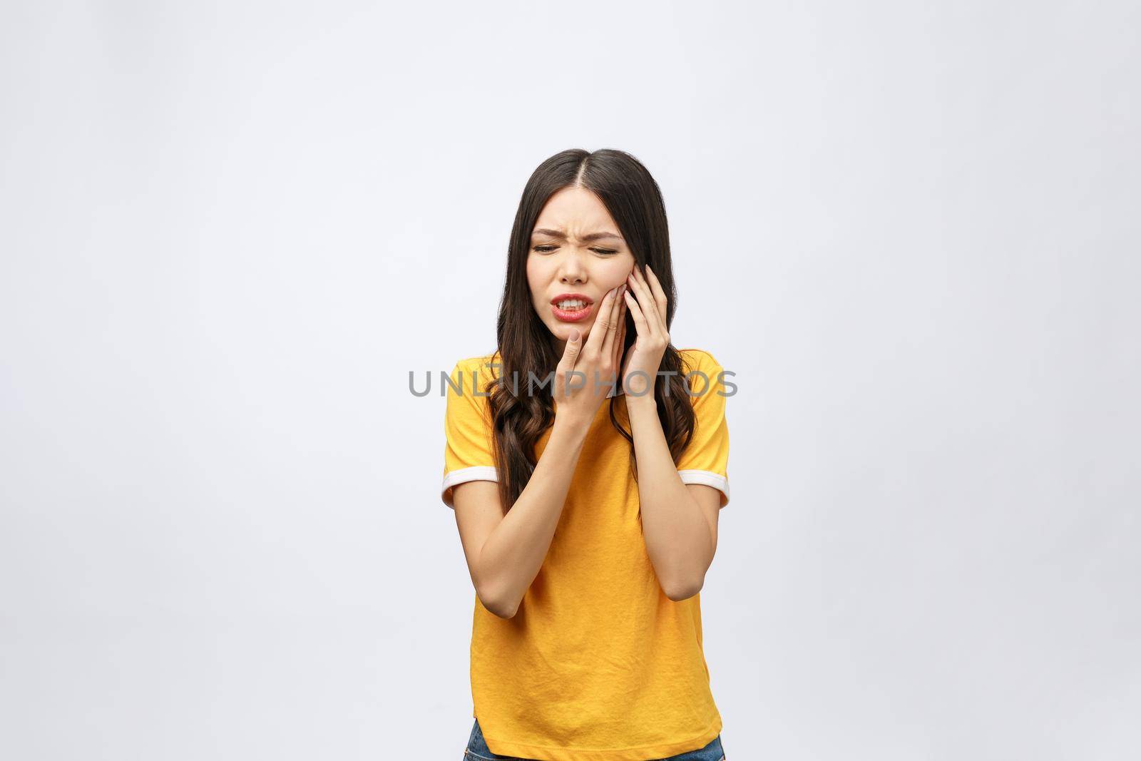 Teeth Problem. Woman Feeling Tooth Pain. Closeup Of Beautiful Sad Girl Suffering From Strong Tooth Pain. Attractive Female Feeling Painful Toothache. Dental Health And Care Concept. High Resolution. by Benzoix