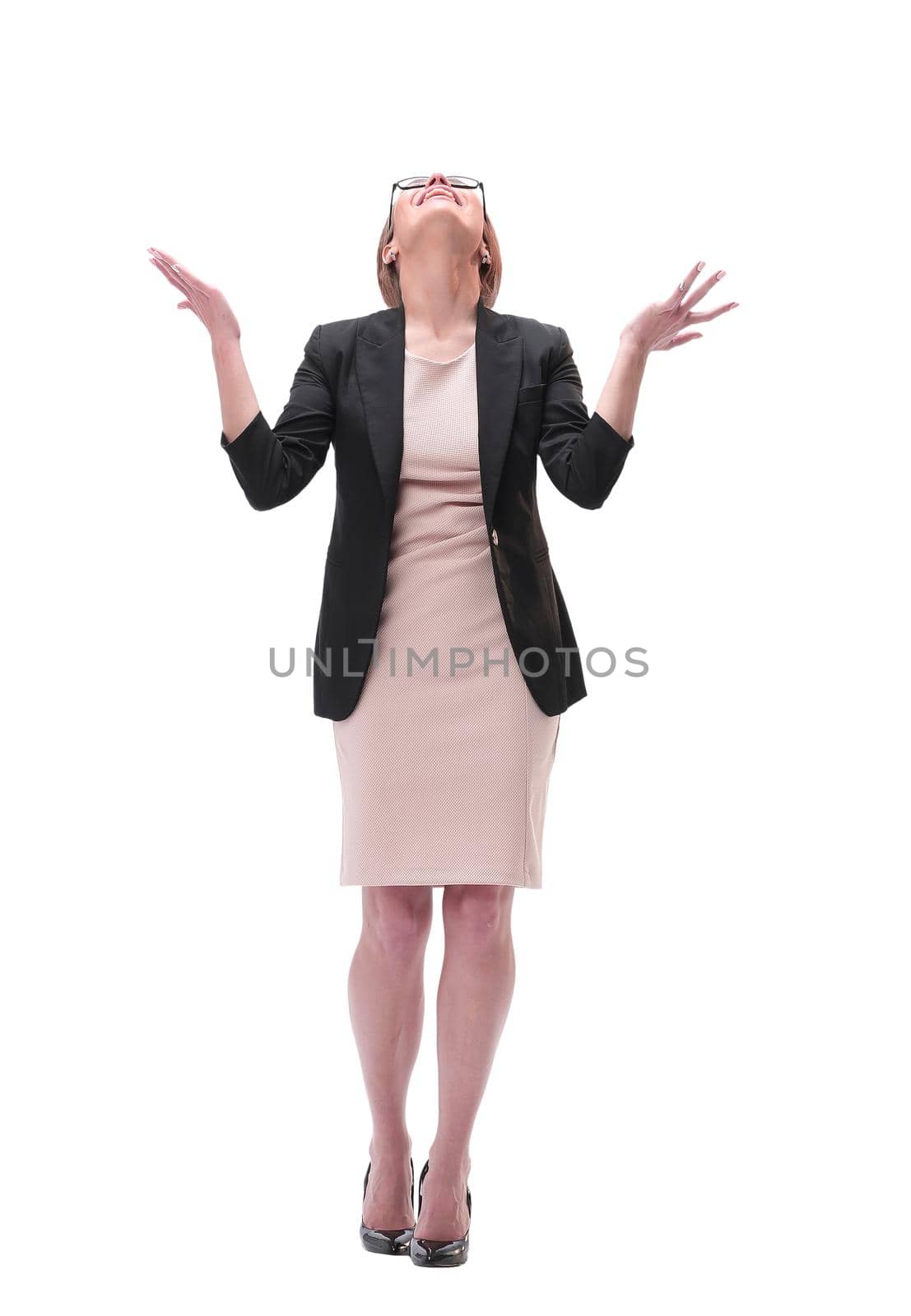 full length . happy young business woman looking up. isolated on white background