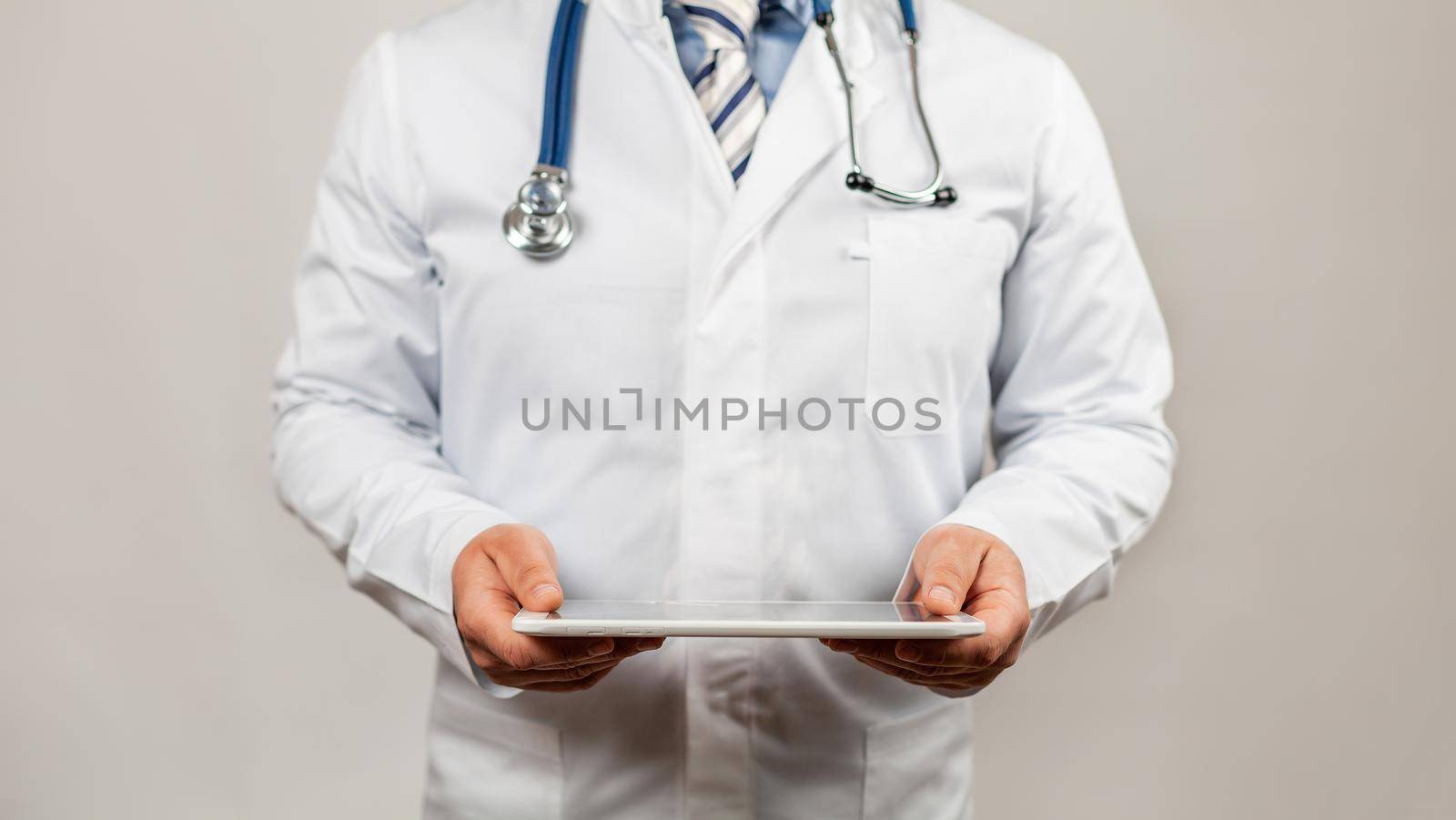 Doctor using a tablet and check with the analysis of the DNA chromosome of a genetic person on a virtual interface. Medicine. Medical science and biotechnology