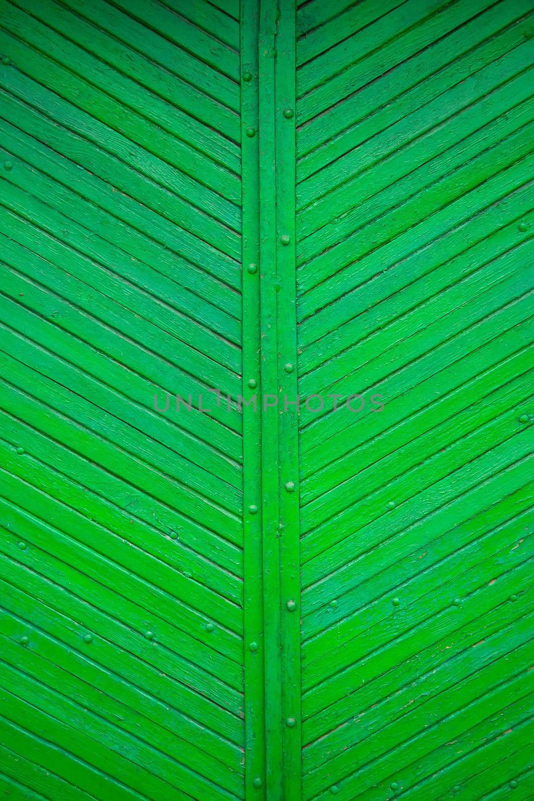 The texture of the old green board located diagonally.