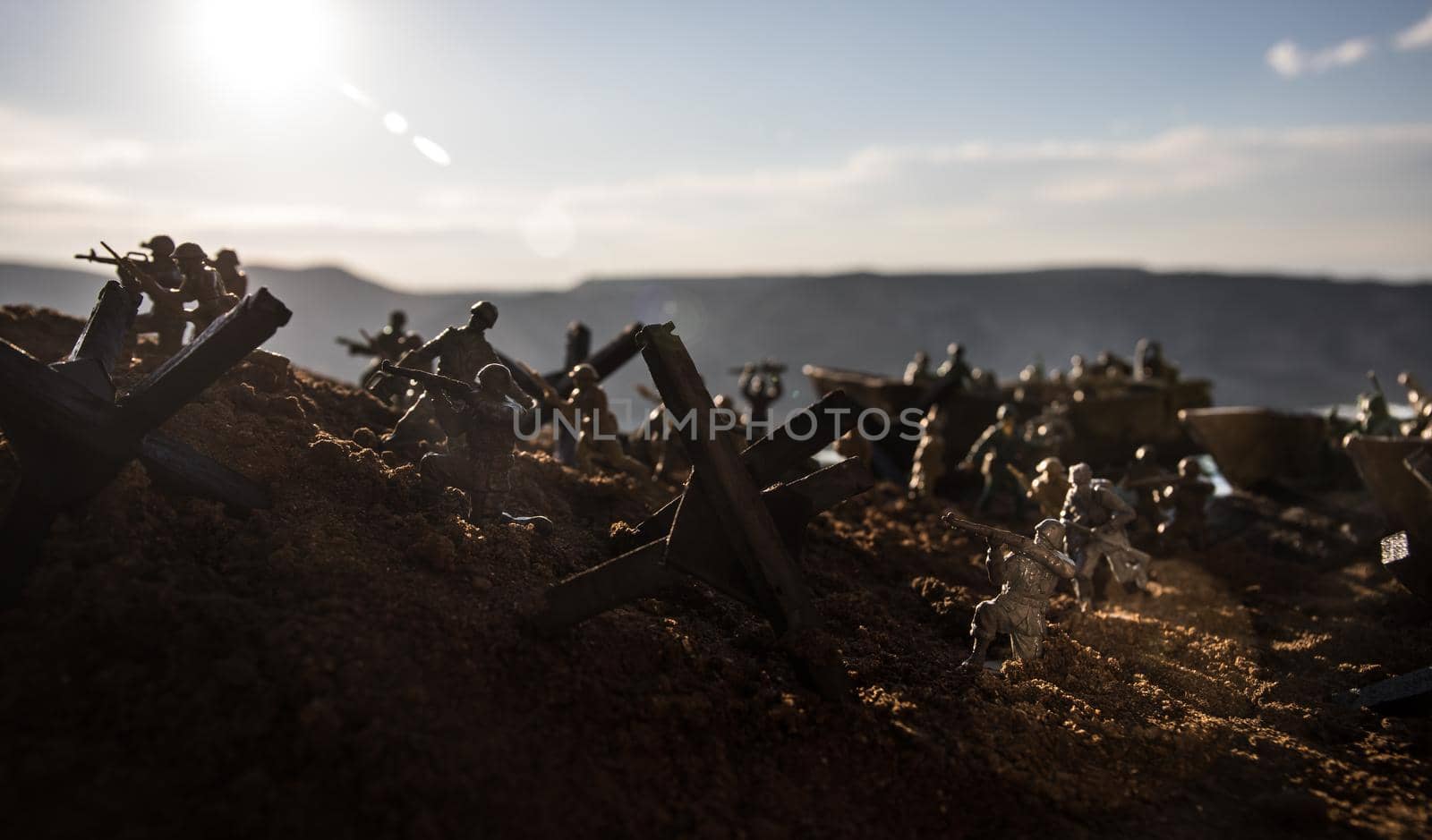 World War 2 reenactment (D-day). Creative decoration with toy soldiers, landing crafts and hedgehogs. Battle scene of Normandy landing on June 6, 1944. Selective focus