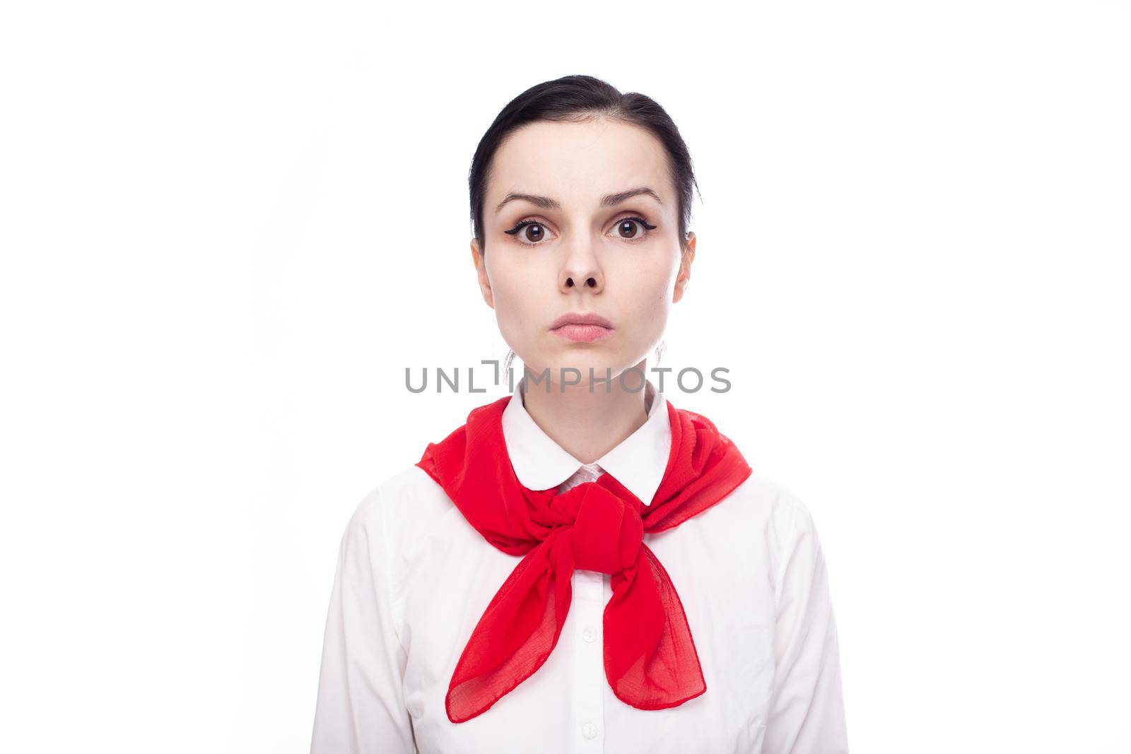 sad woman in a white shirt and a red scarf around her neck. High quality photo