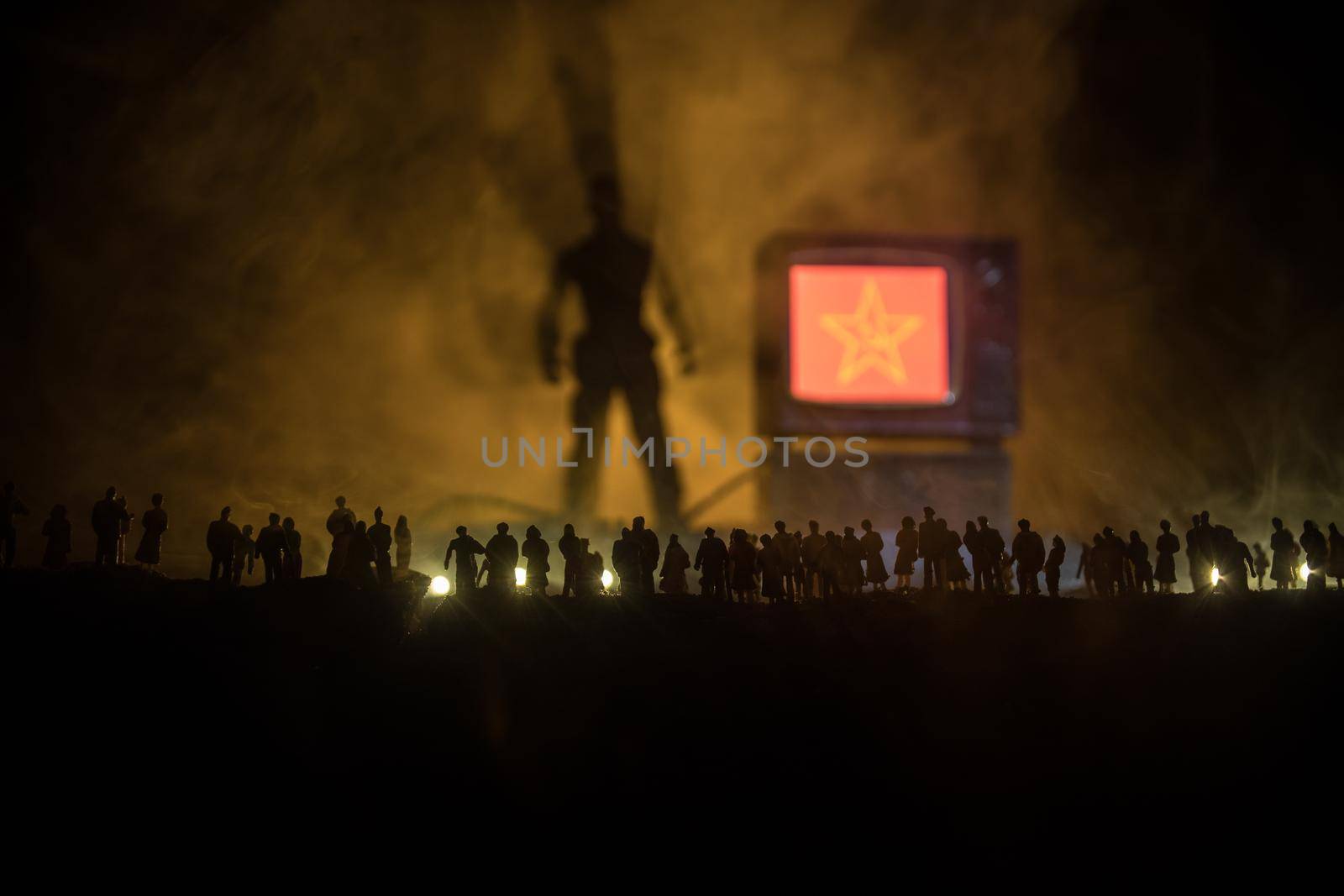 Fake news on TV concept. Silhouettes of crowd looking on giant TV box. Creative artwork decoration. Selective focus