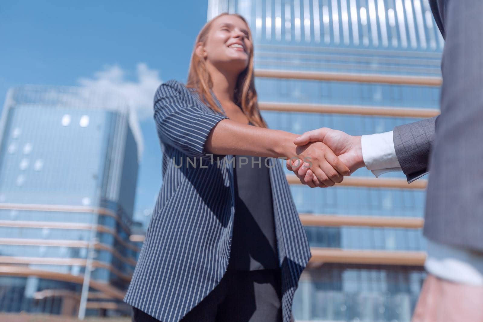 young woman shaking hands with her business partner. photo with copy space