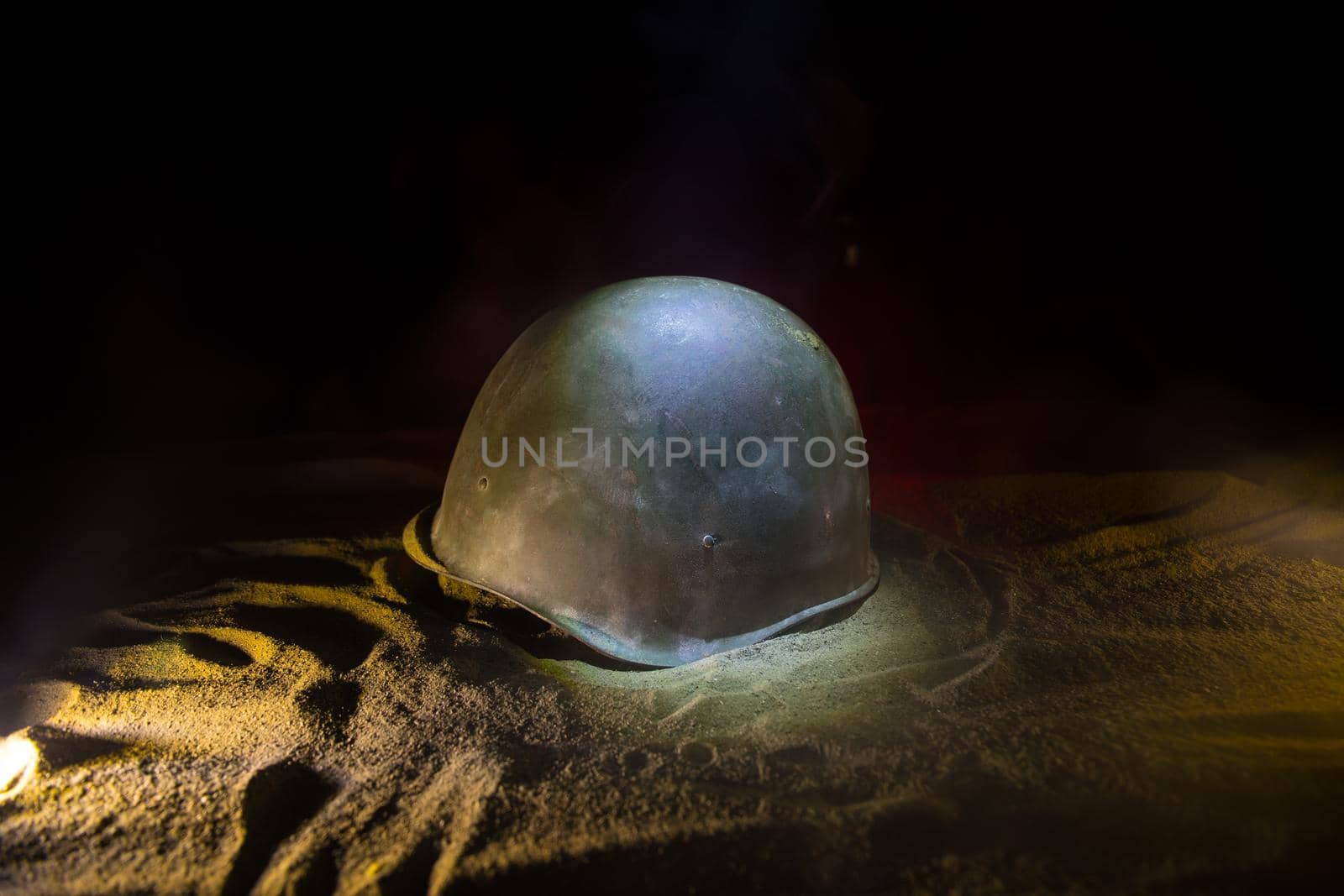 Soviet army Helmet Second World War in dark. Selective focus by Zeferli