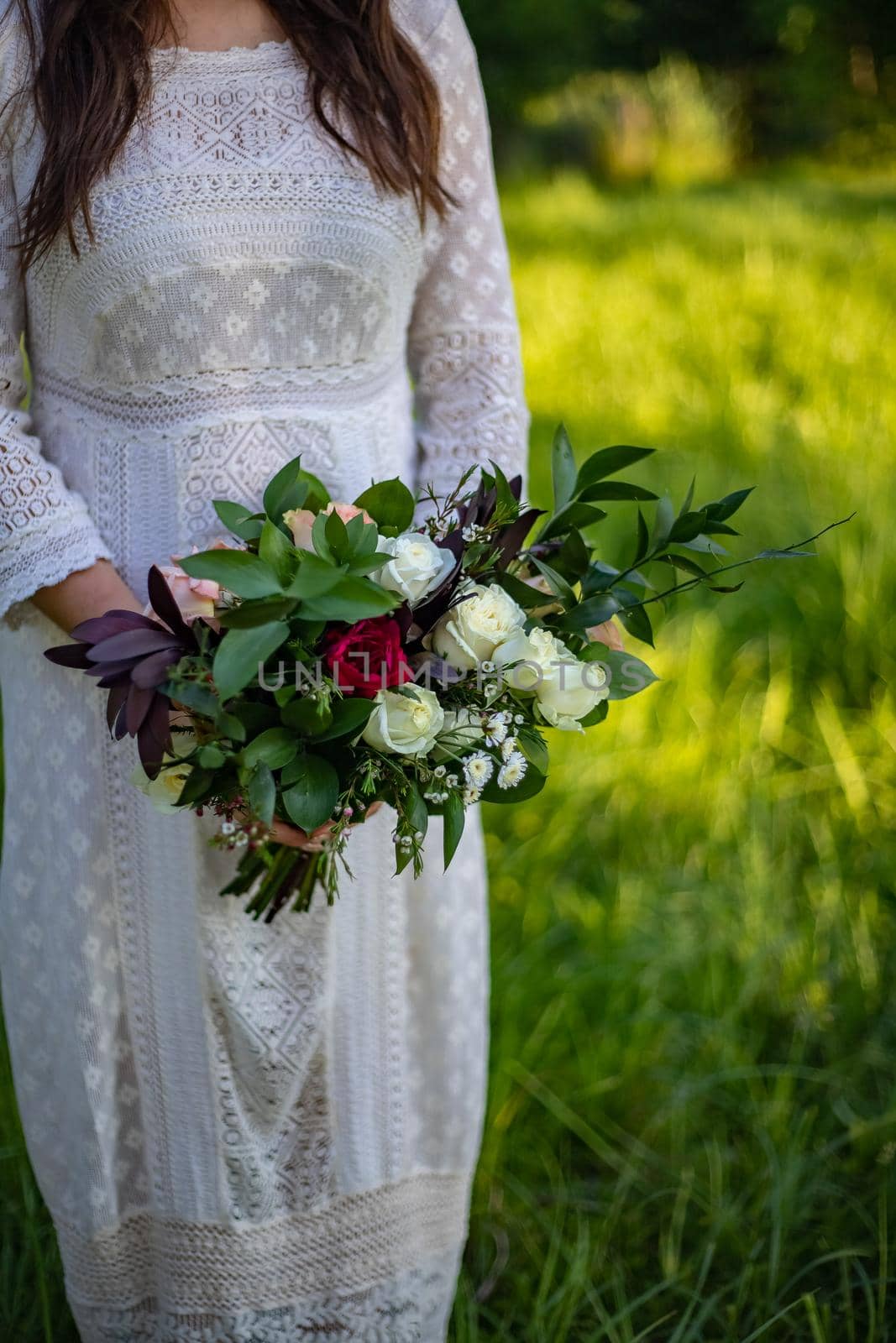 nice portrait of beautiful and young groom and bride outdoors