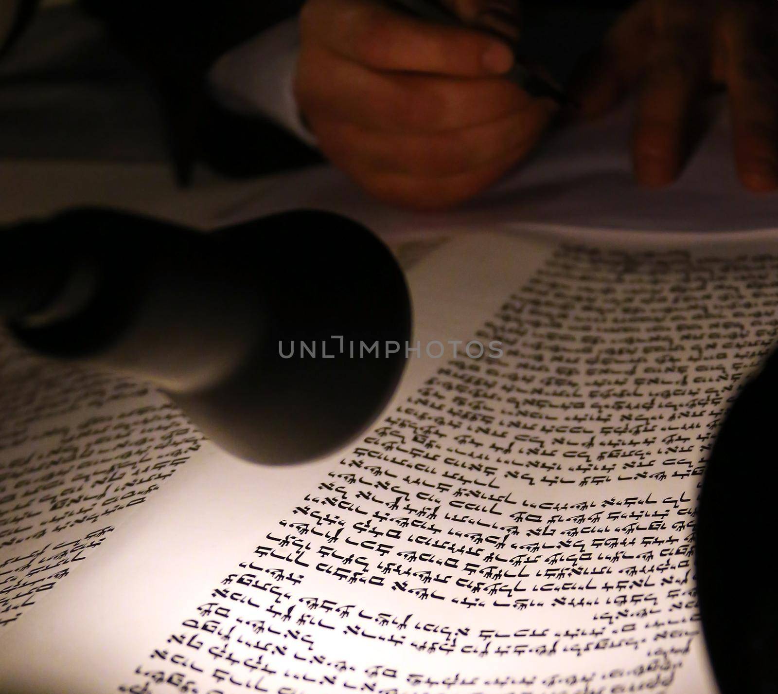 Boy reading Torahjudaism.Torah. A sacred roll which is written in manual