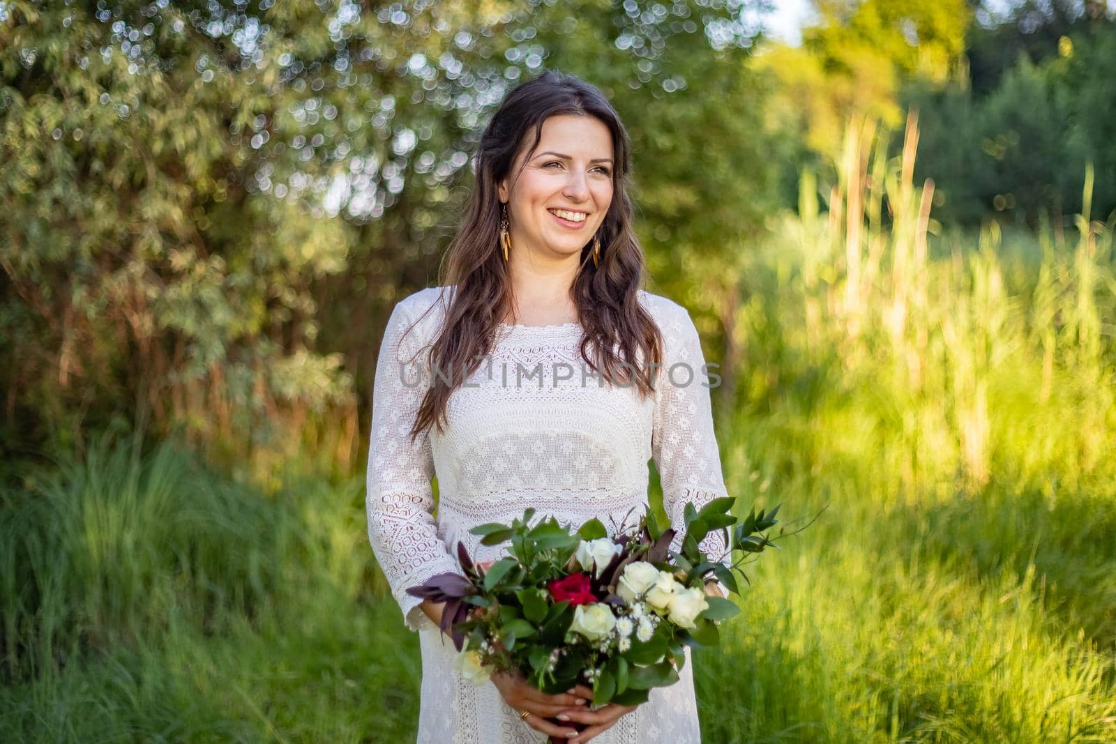 Beautiful Bride wedding day outdoors, happy newlywed woman with marriage flowers bouquet. by Anyatachka