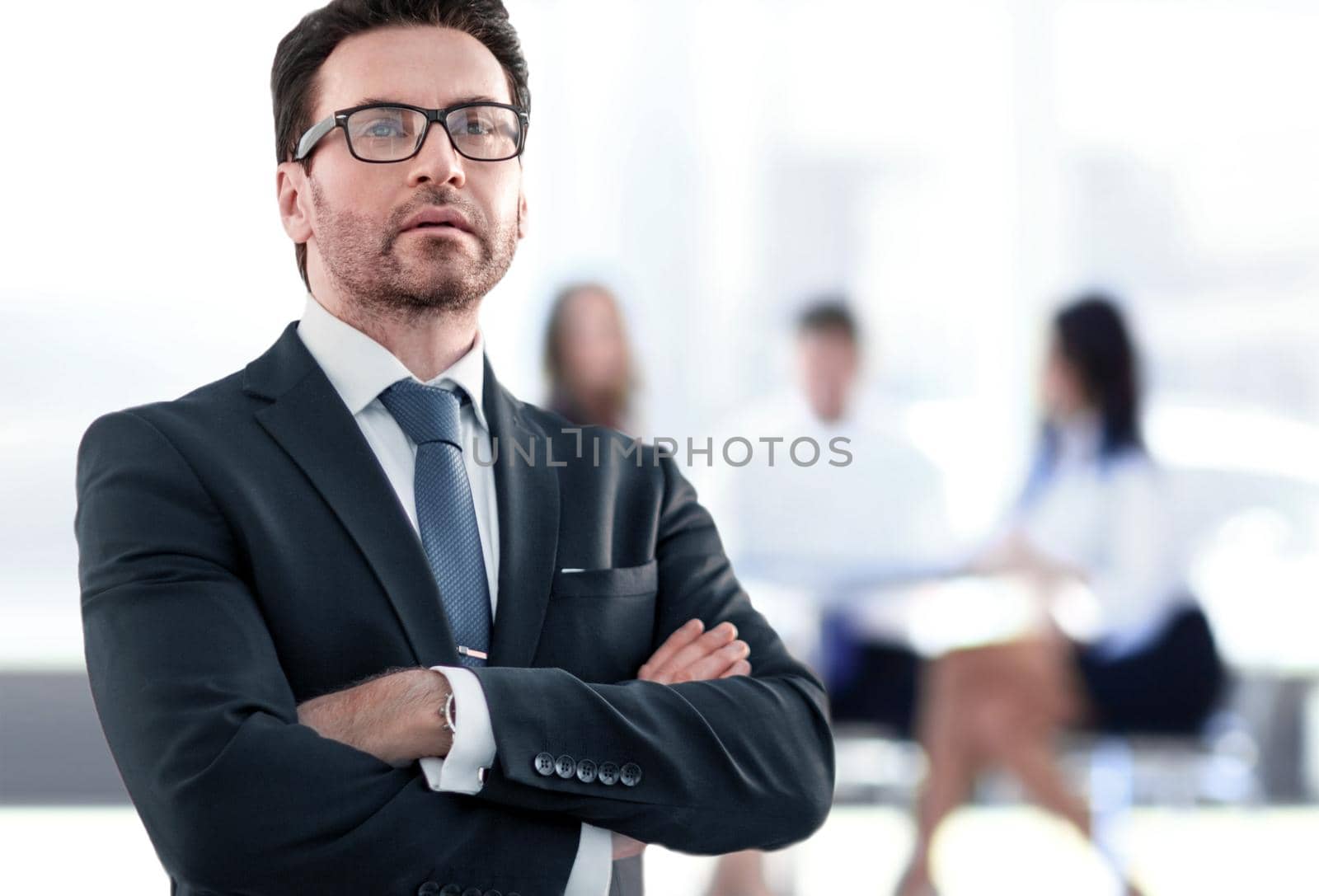 Businessman standing near the window and looking into it.photo with copy space