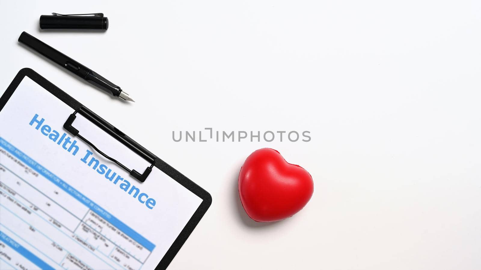 Flat lay medical report and heart on white background. Cardiology, healthcare and medical concept.