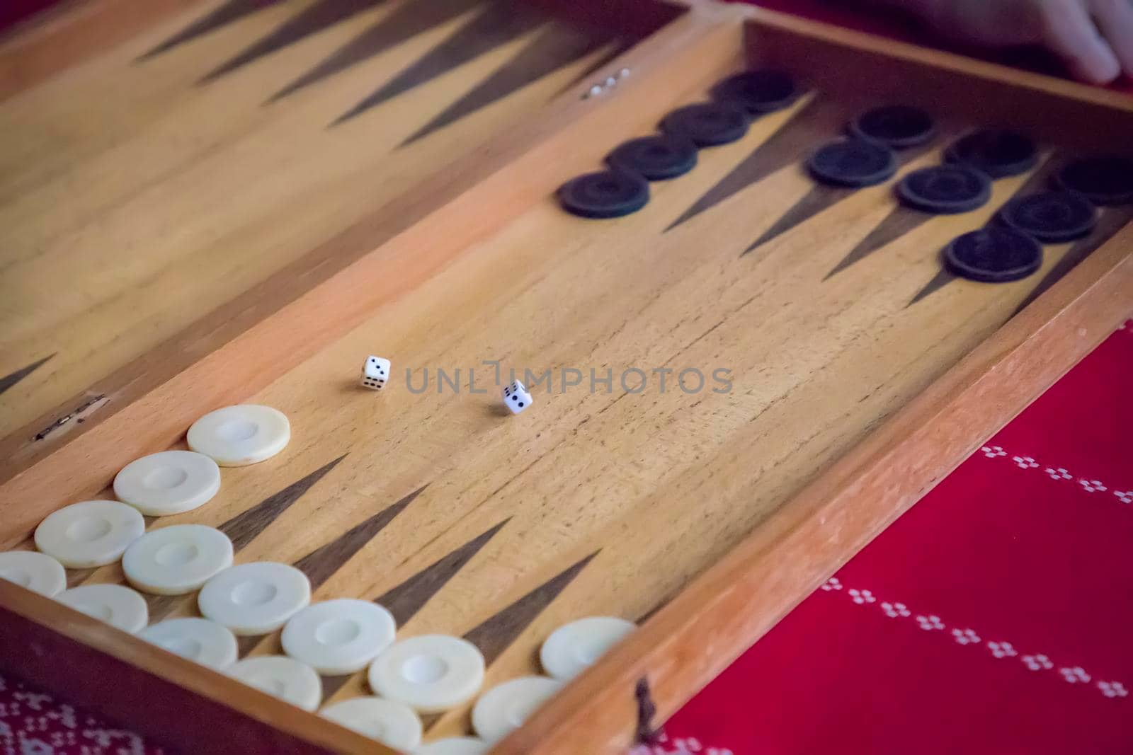 thrown dice on the table while playing backgammon