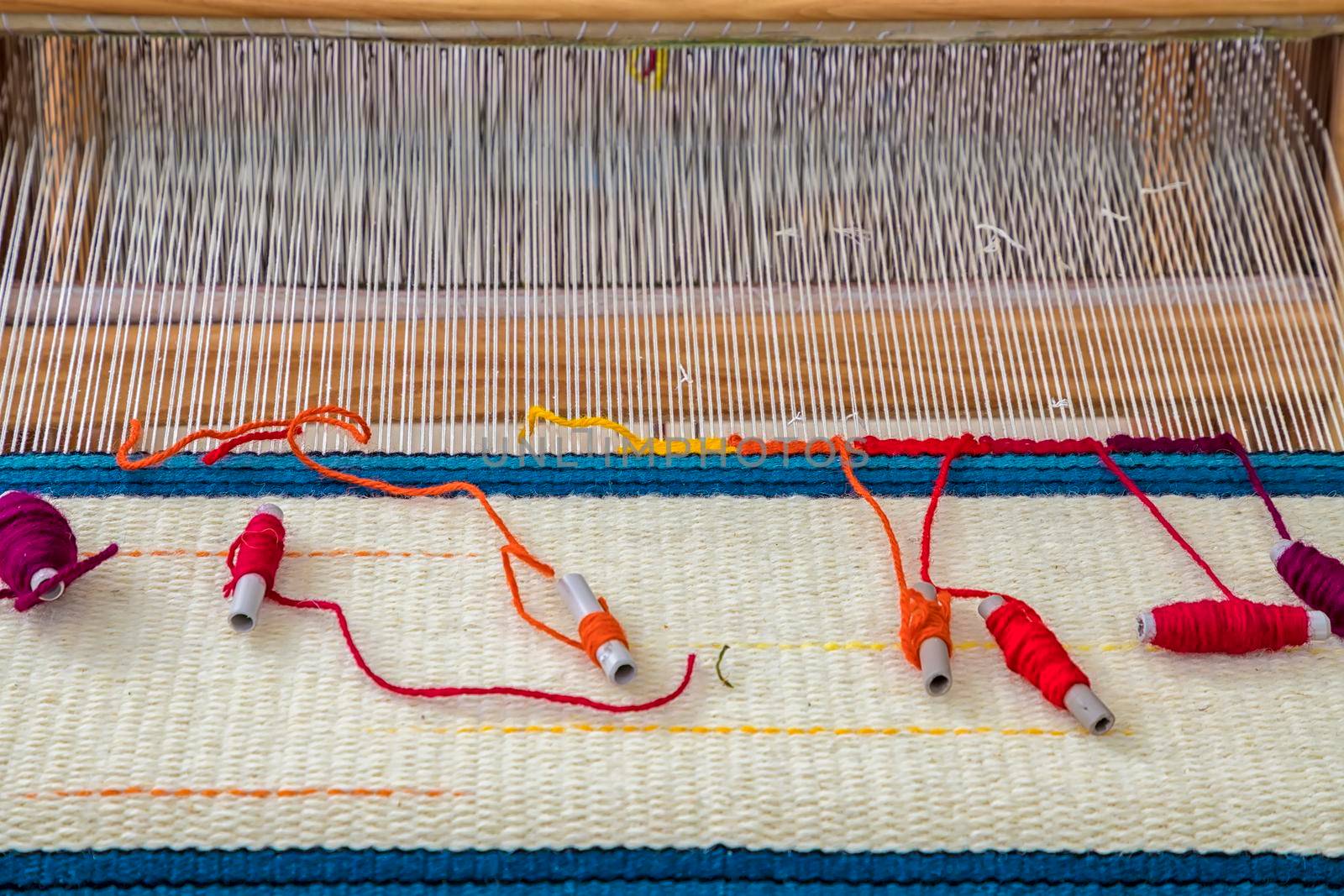 A traditional colorful vintage weaving loom. by EdVal