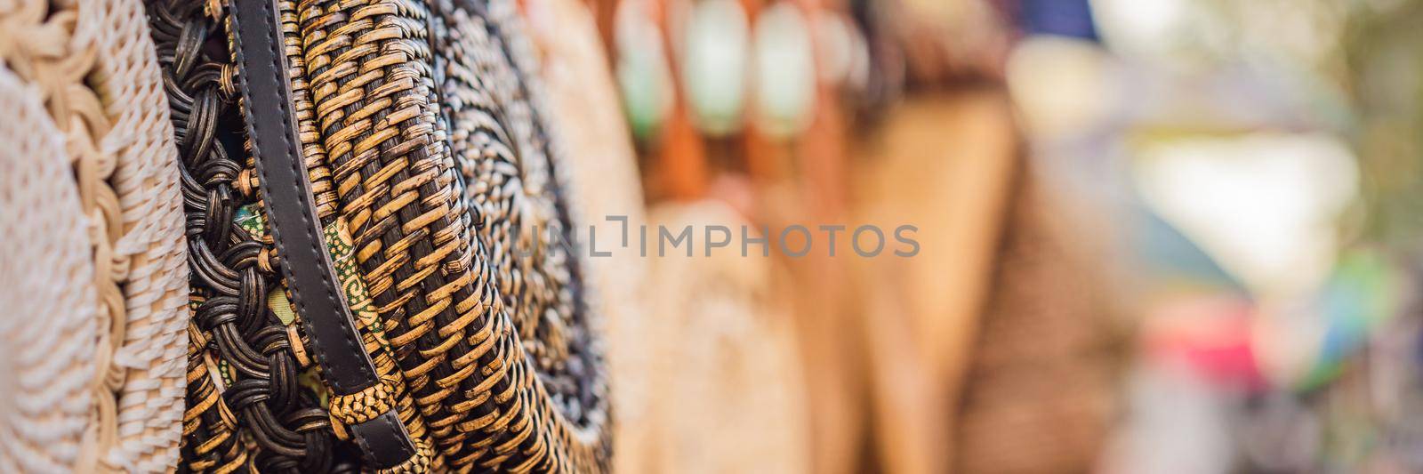 Typical souvenir shop selling souvenirs and handicrafts of Bali at the famous Ubud Market, Indonesia. Balinese market. Souvenirs of wood and crafts of local residents BANNER, LONG FORMAT by galitskaya