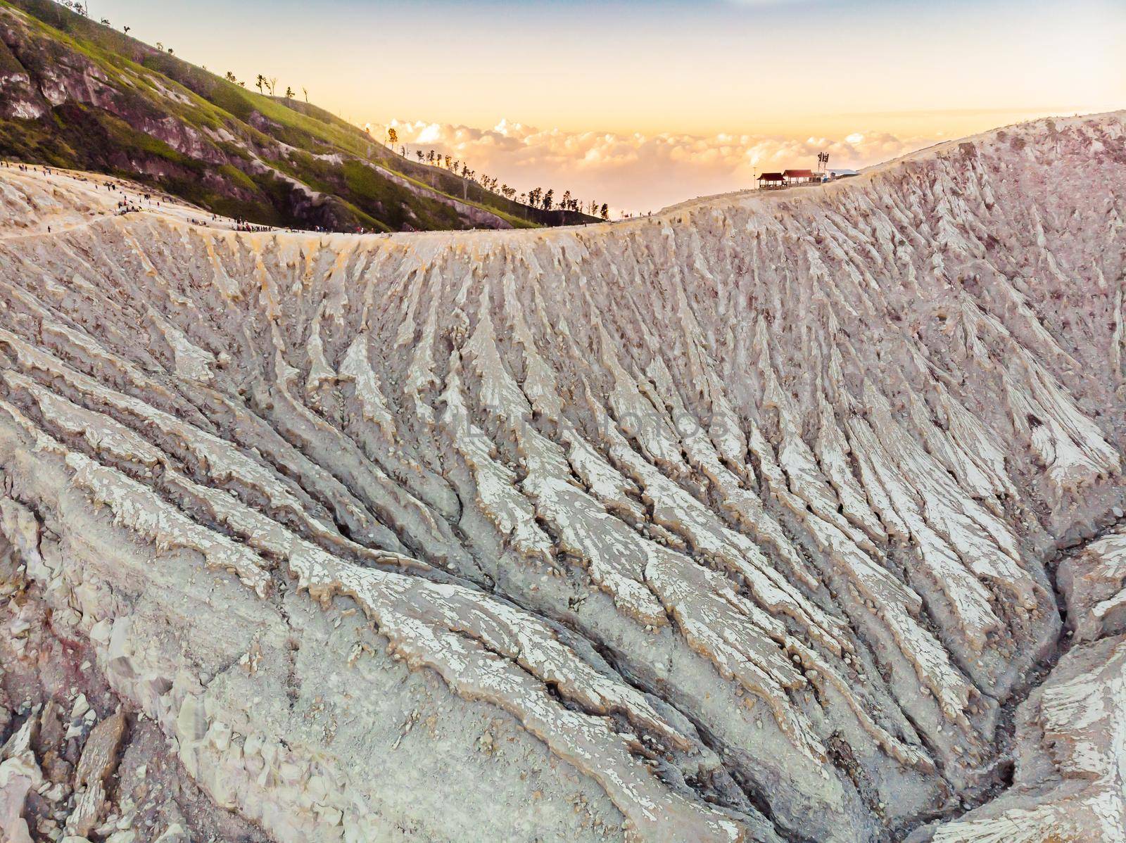 Aerial shot of the Ijen volcano or Kawah Ijen on the Indonesian language. Famous volcano containing the biggest in the world acid lake and sulfur mining spot at the place where volcanic gasses come from the volcano.