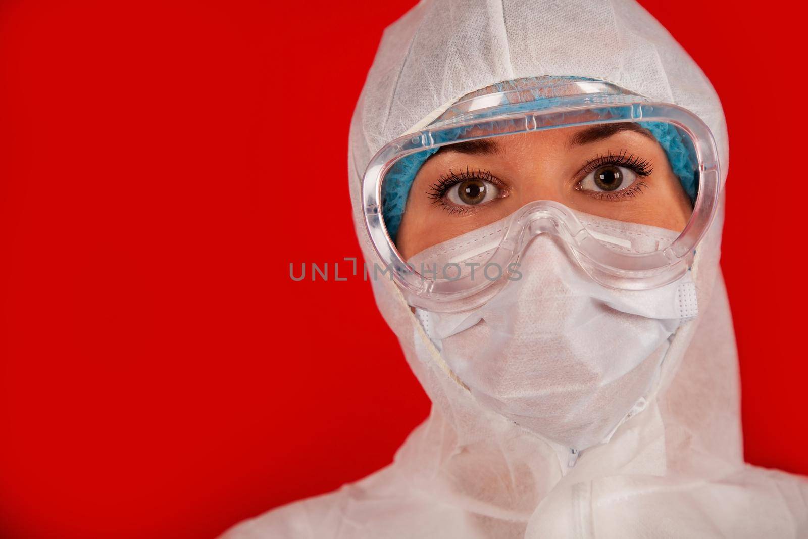 Doctor woman in a protective suit against coronavirus. Medical staff, preventive equipment. Doctor woman in a protective suit against coronavirus. Medical staff, preventive equipment