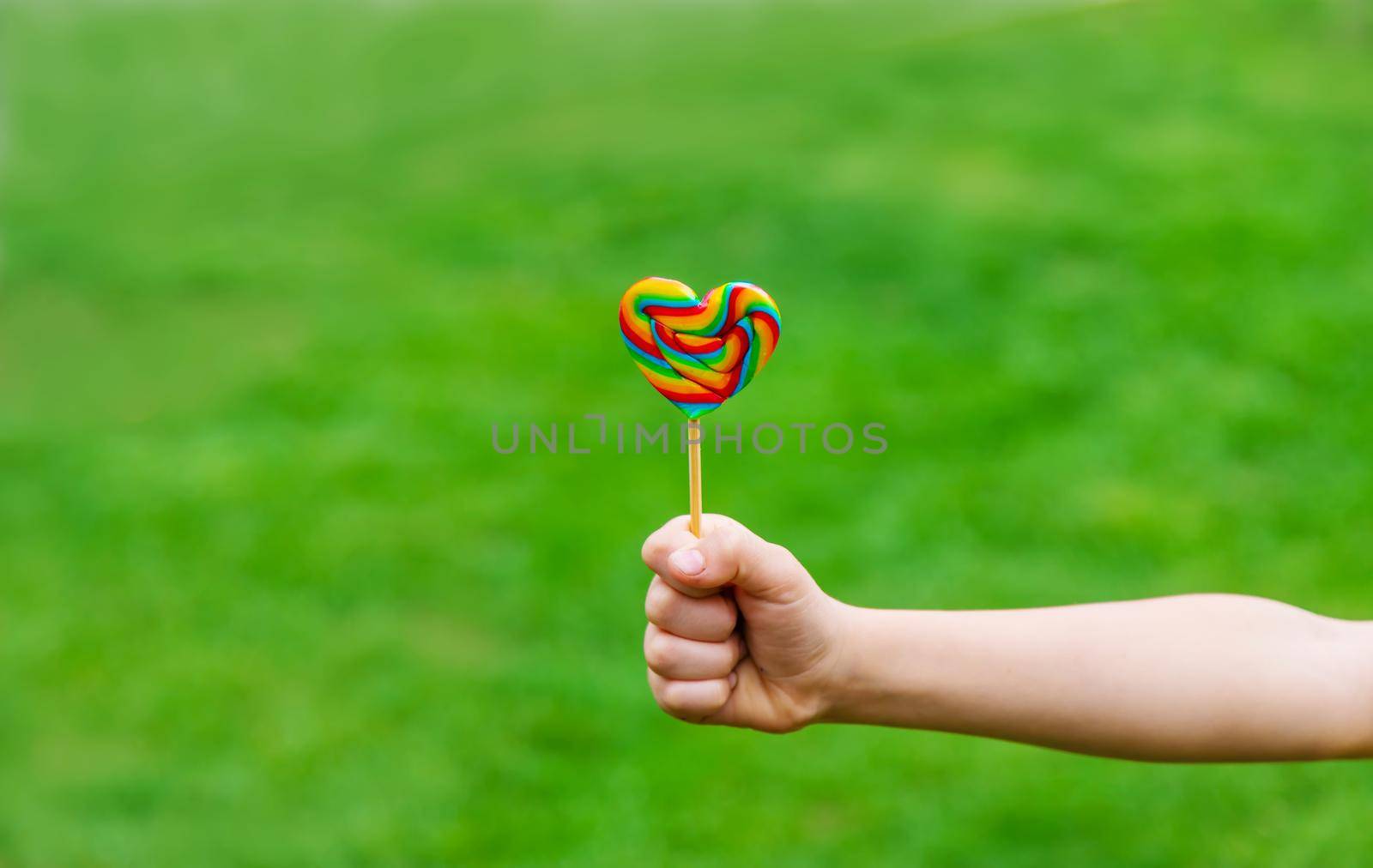 Lollipops in the hands of children. Selective focus. nature.