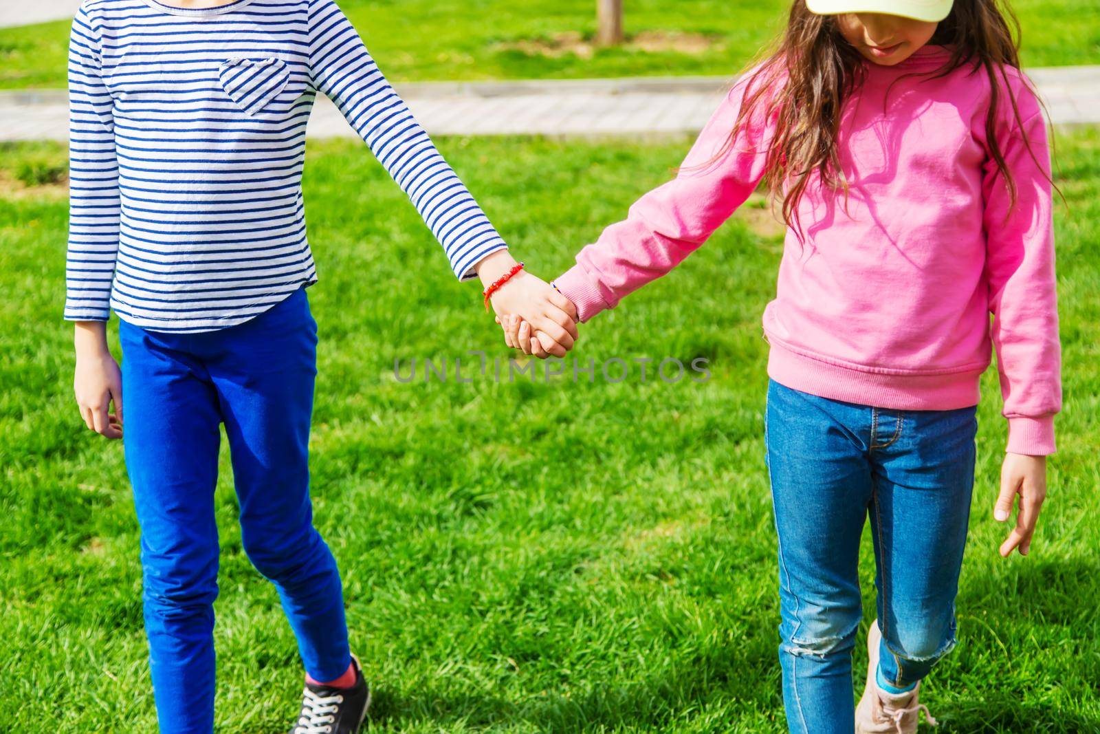 children holding hands in the park.selective focus.kids
