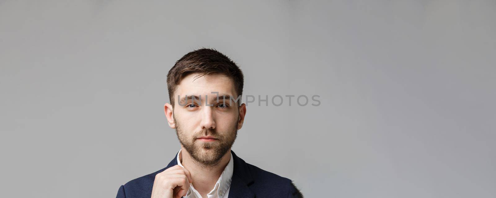 Business Concept - Portrait handsome stressful business man in suit shock looking in front of laptop at work office. White Background. by Benzoix