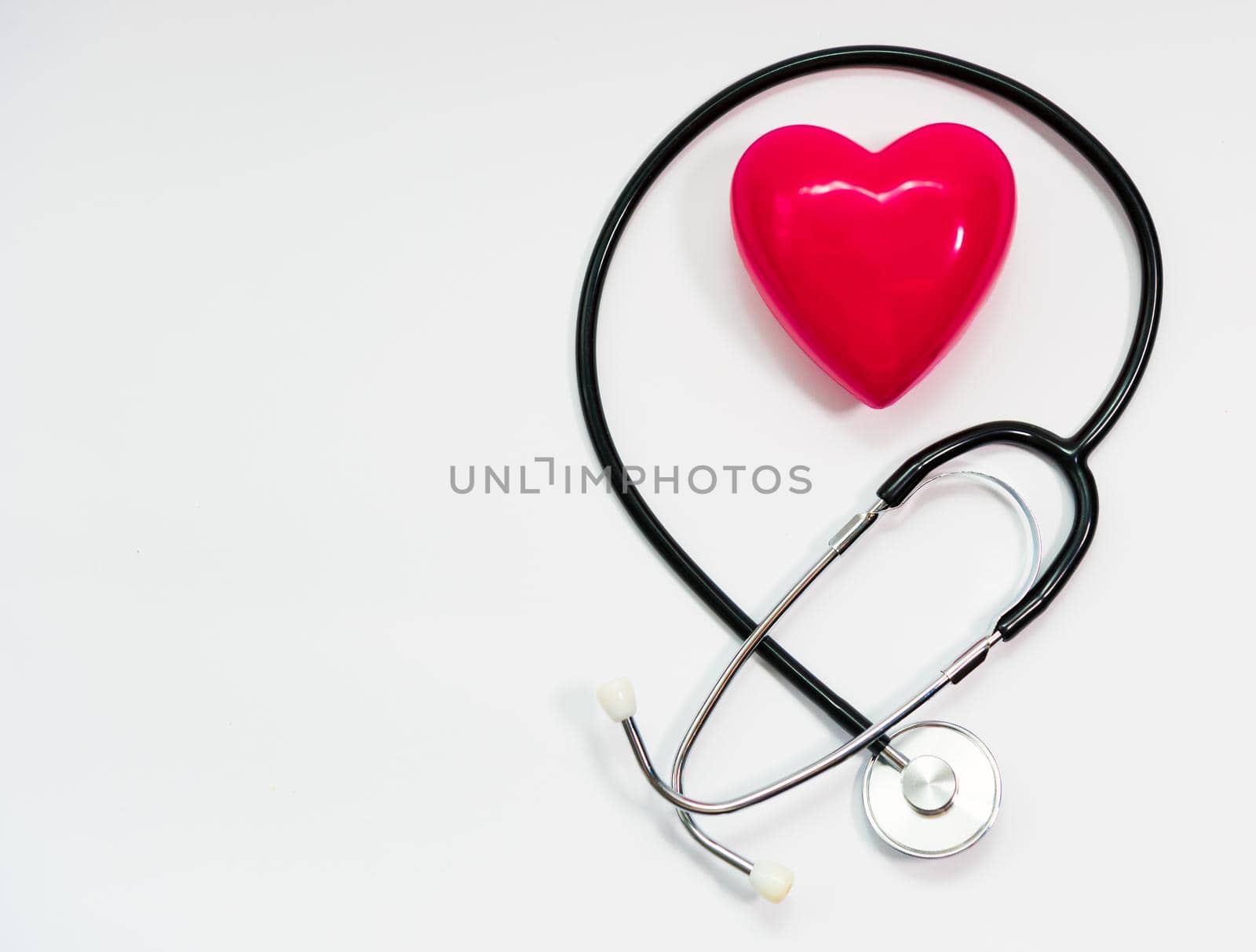 Stethoscope for measuring blood pressure on a white background, heart