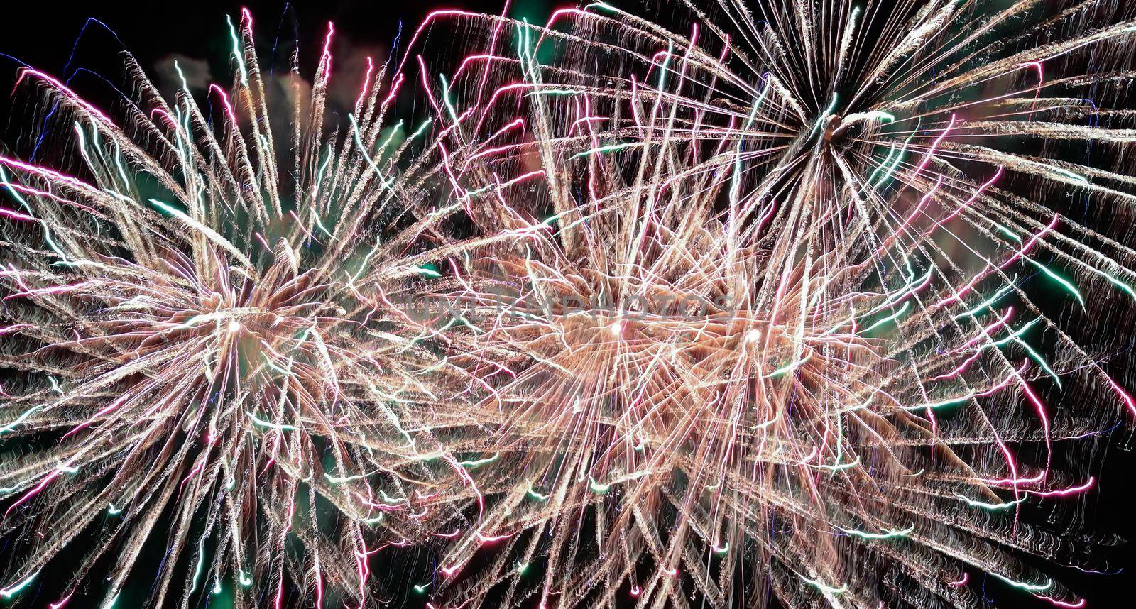 Colorful fireworks of various colors over night sky