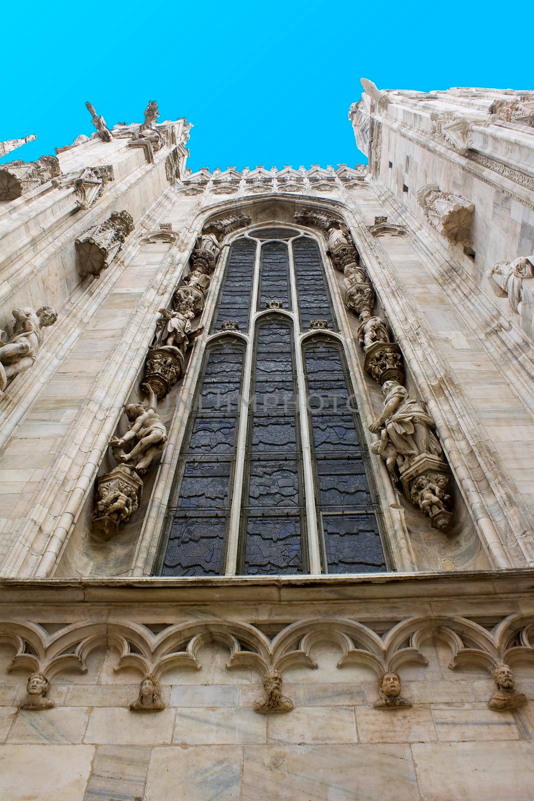 Milan Duomo cathedral exterior window blue sky