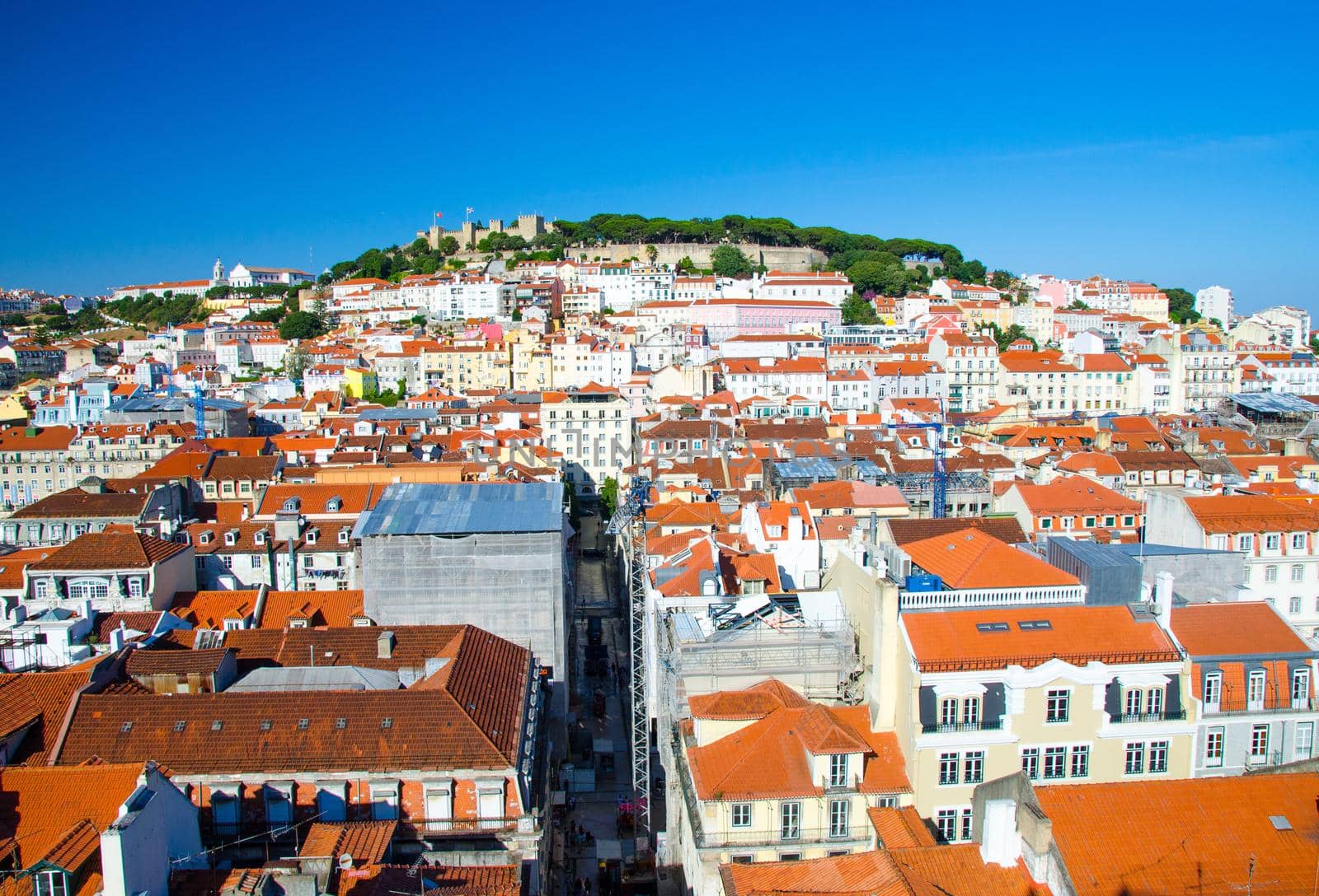 Portugal, night panoramic view of Lisbon in summer, Lisbon fortress hill lose-up, touristic centre of Lisbon, St. George's medieval Castle in Lisbon, forest on the highest hill in Lisbon